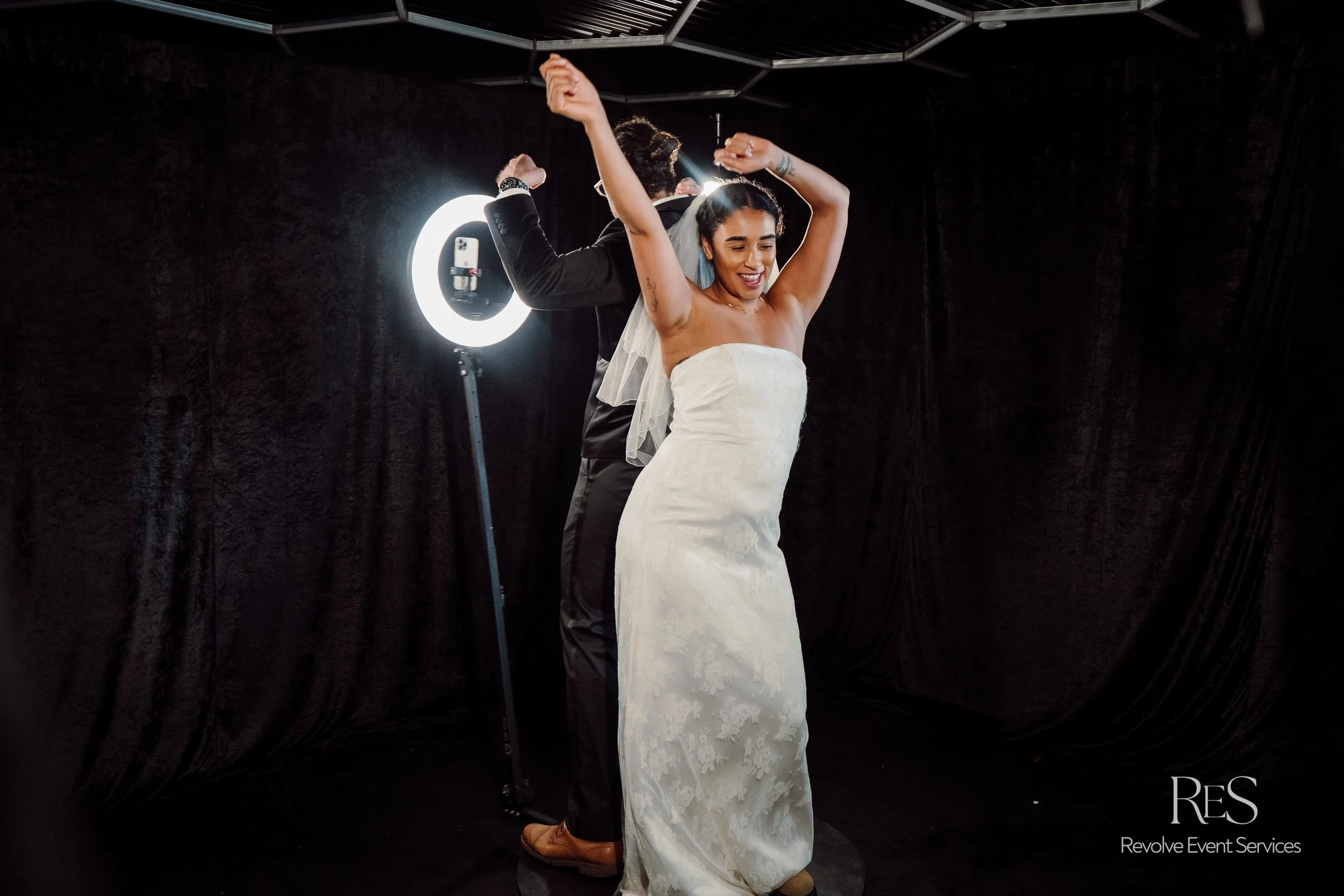 Bride using 360 photo booth at Toronto wedding reception
