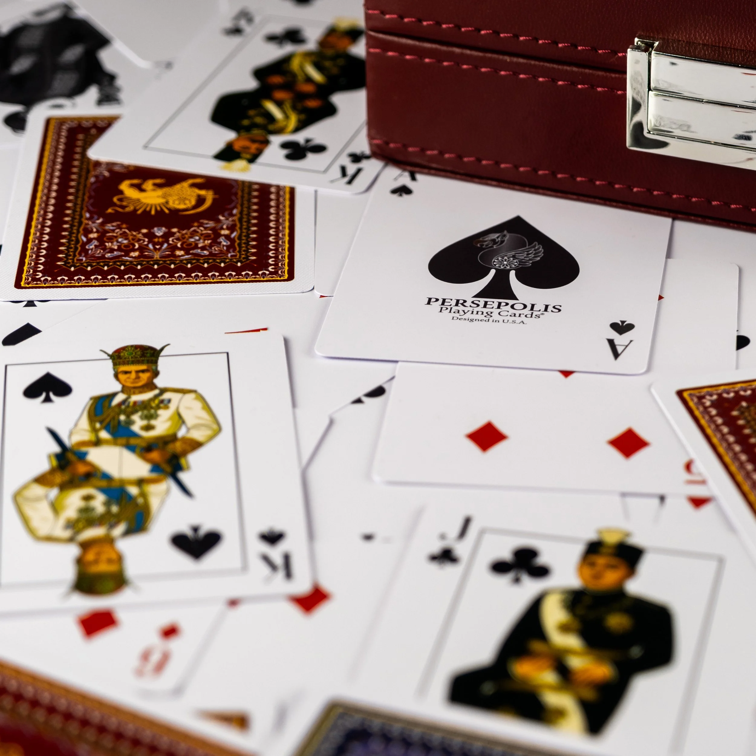The Royals deck features velvet inside lining with gold prints and various important Persian historical figures such as Crown Prince Reza Pahlavi