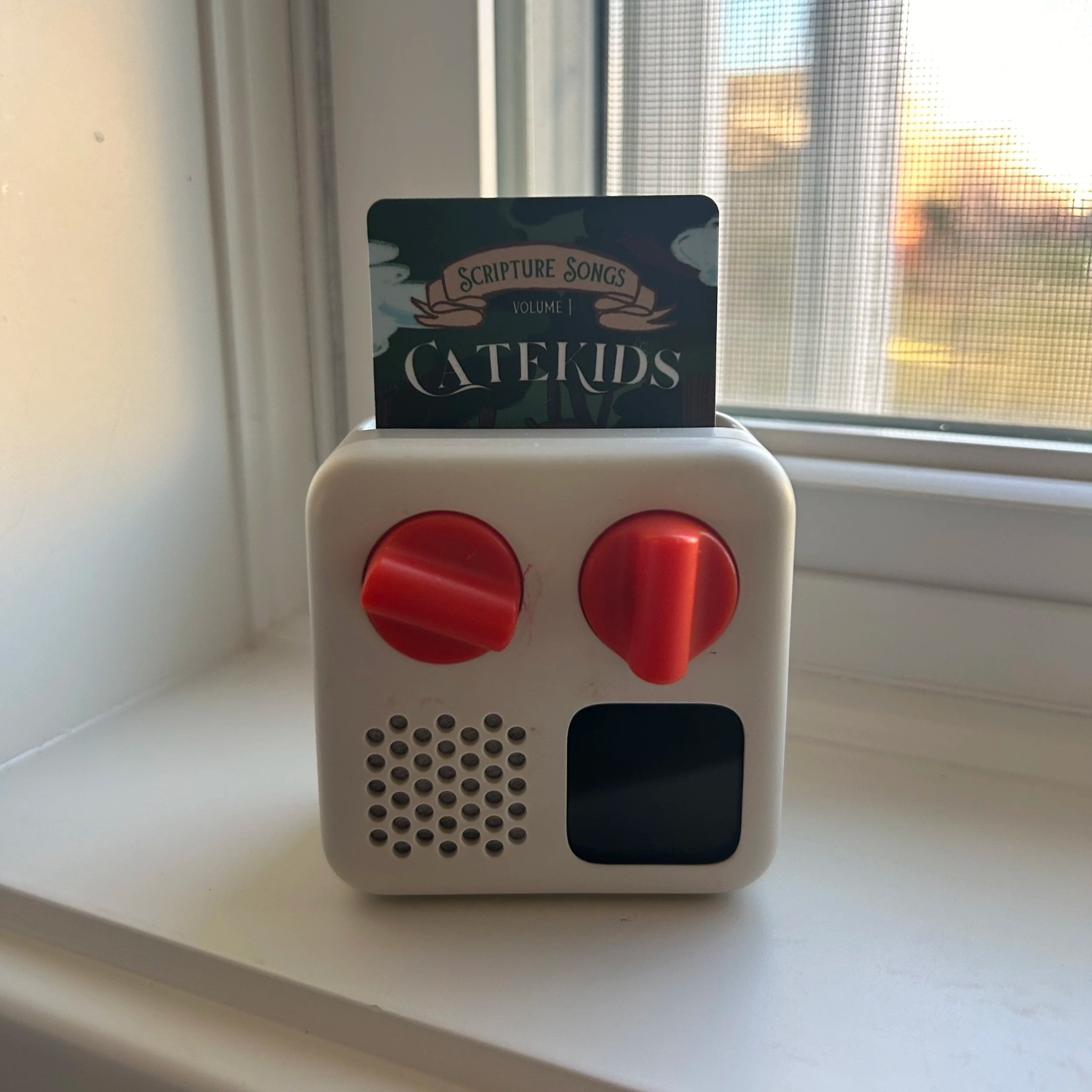Yoto Mini playing the CateKids Volume 1 Scripture Songs card