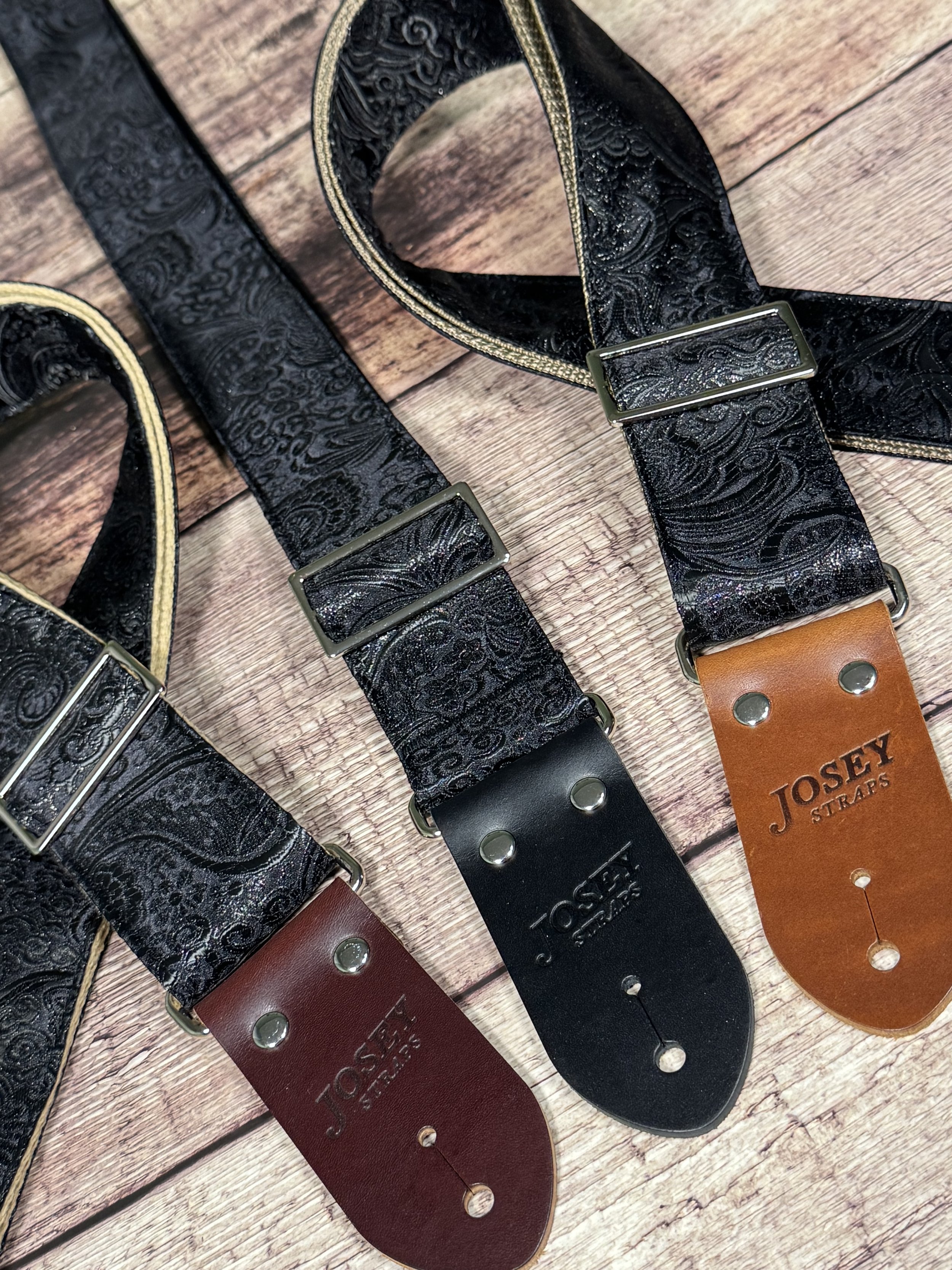 Black textured guitar strap with leather ends by Josey Straps called The Abyss