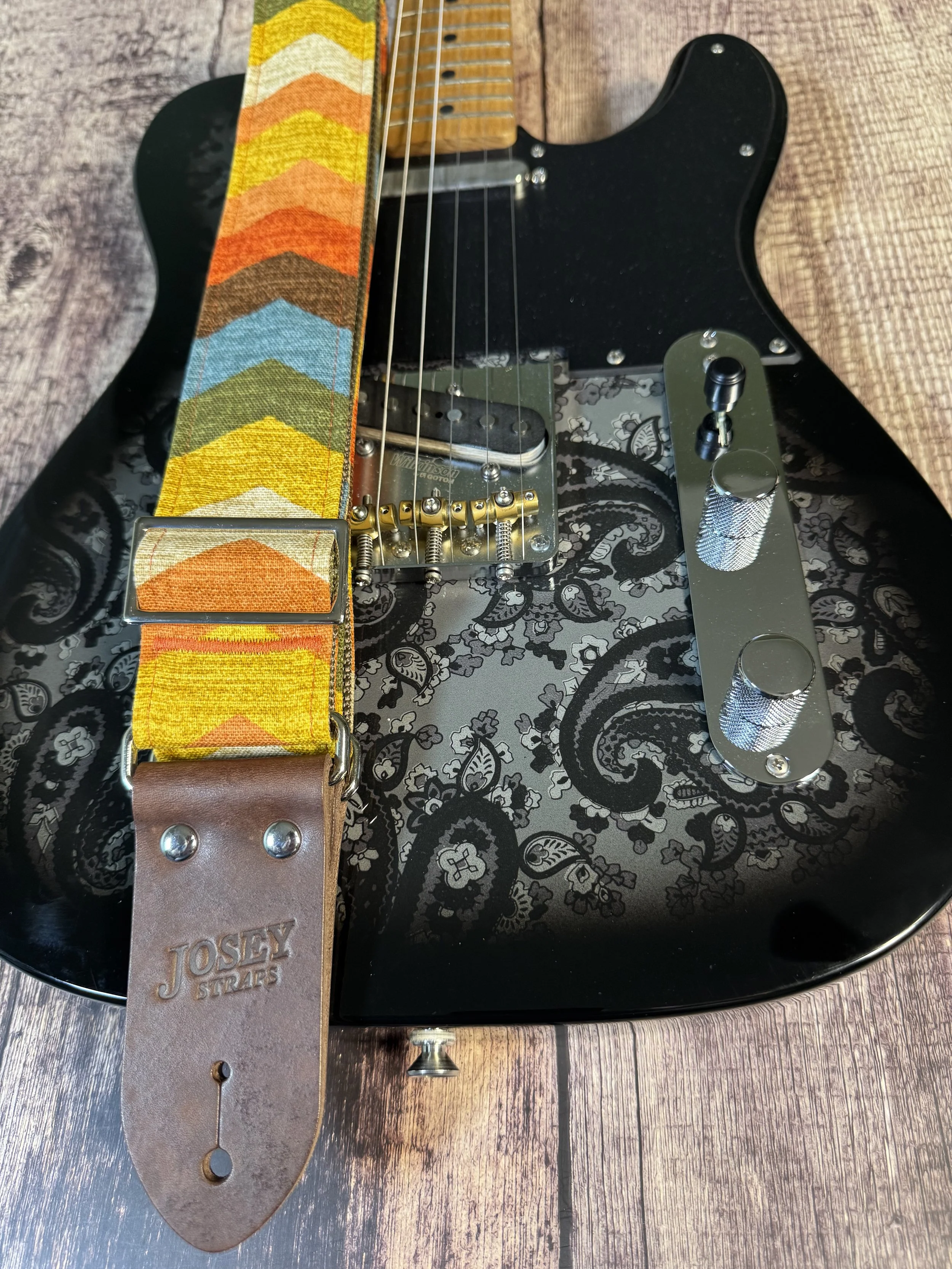 Old Mexico guitar strap by Josey Straps, vintage Southwestern chevron design in earthy tones with leather ends, bold retro style.