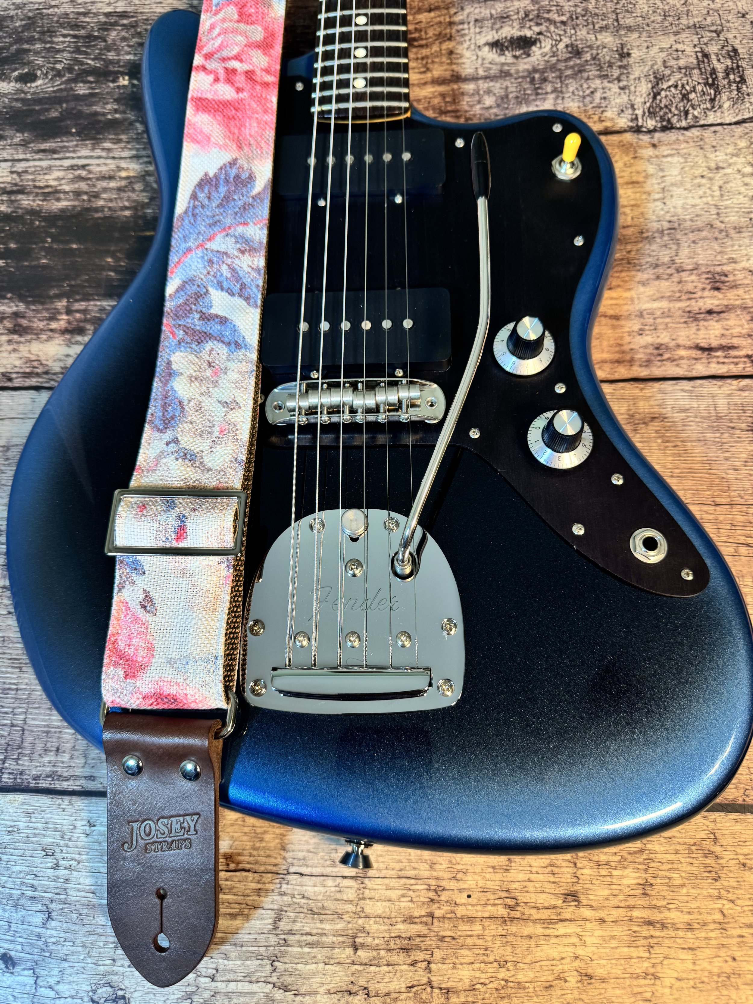 Kensington handmade floral guitar strap by Josey Straps with watercolor pink and blue floral fabric and premium leather ends.