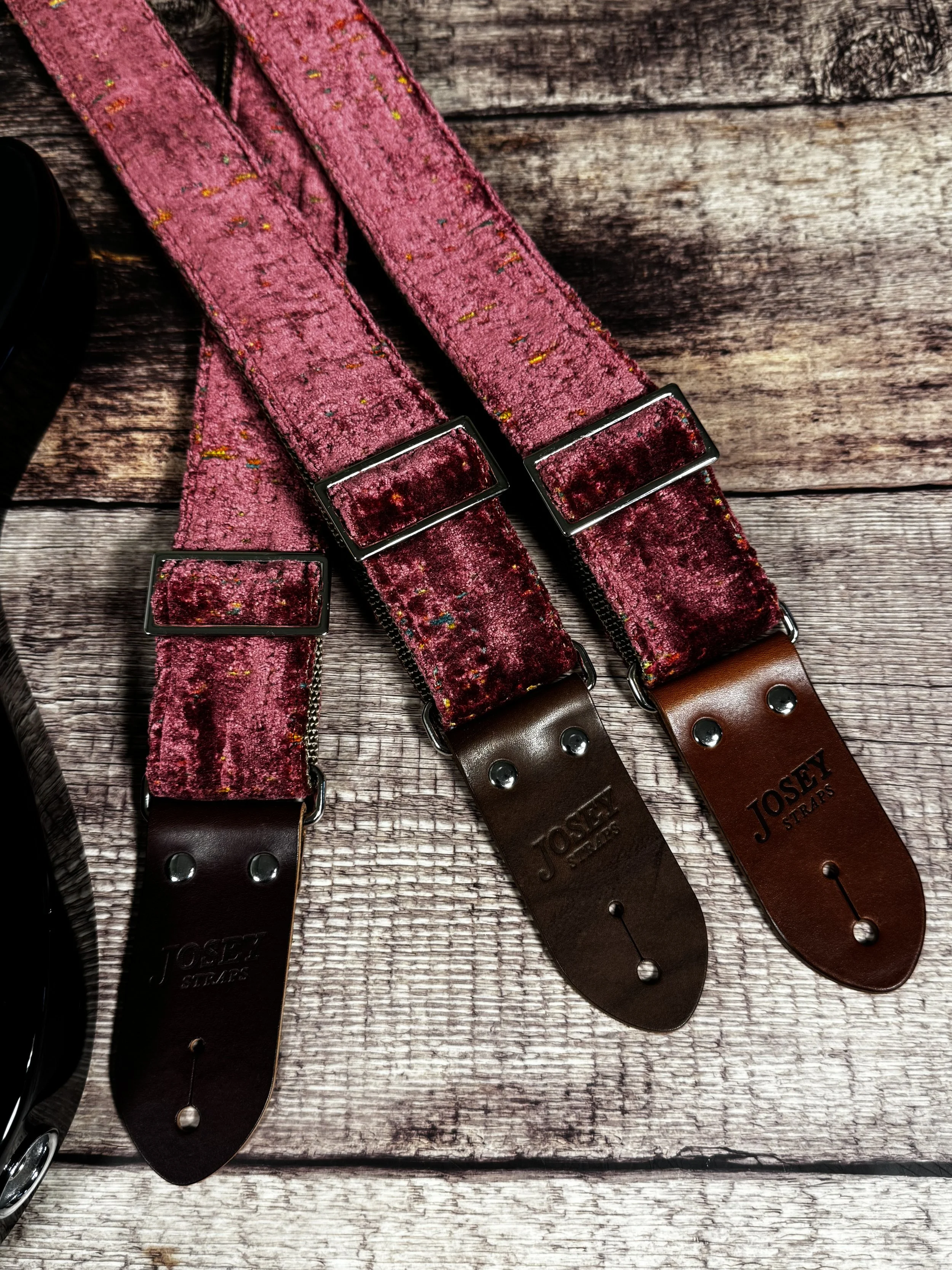 Telly handmade pink guitar strap by Josey Straps featuring textured dusty-rose fabric with colorful flecks and premium leather ends.