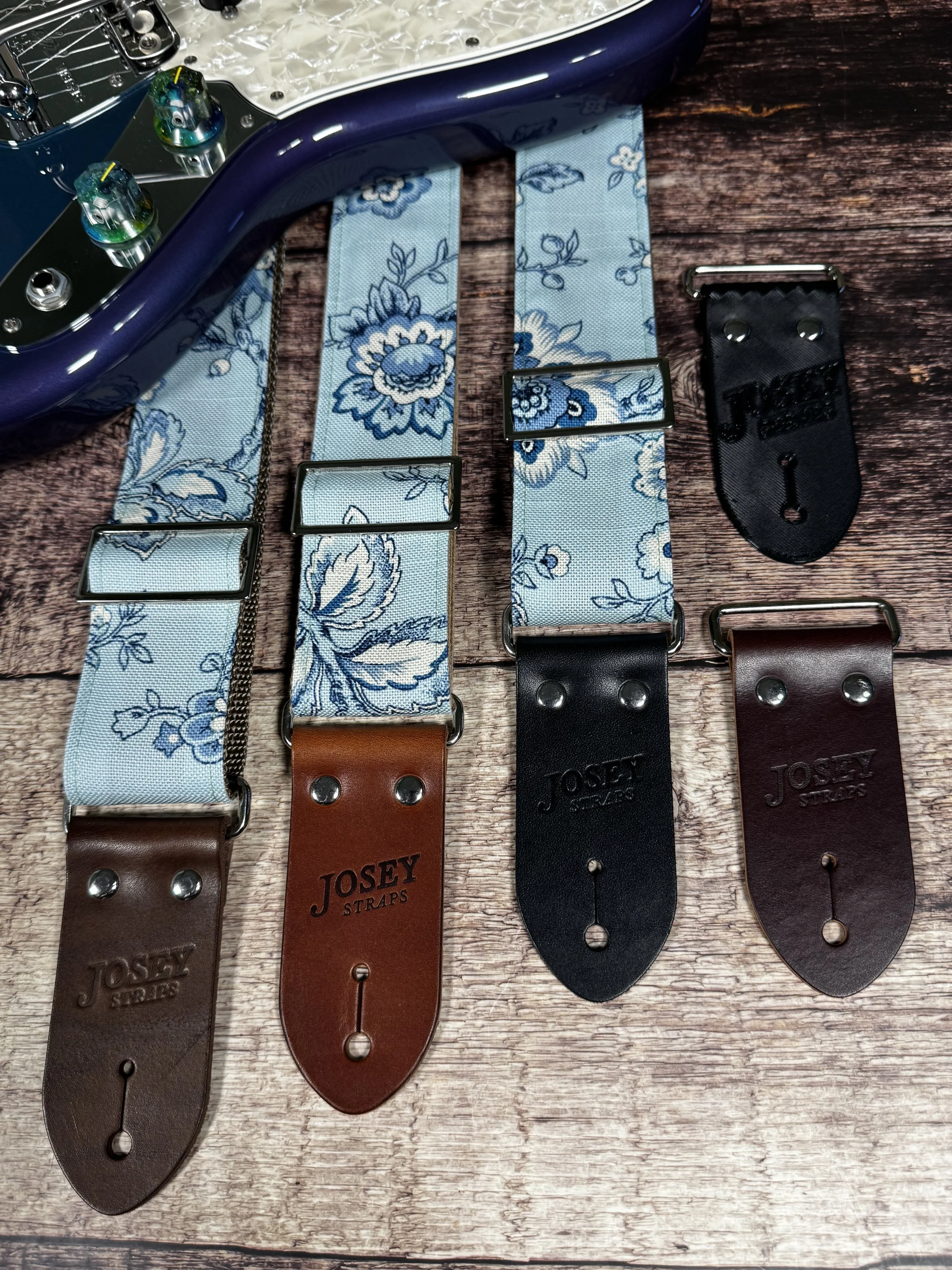 Something Blue floral guitar strap by Josey Straps featuring a powder blue and cream vintage floral pattern with premium leather ends.