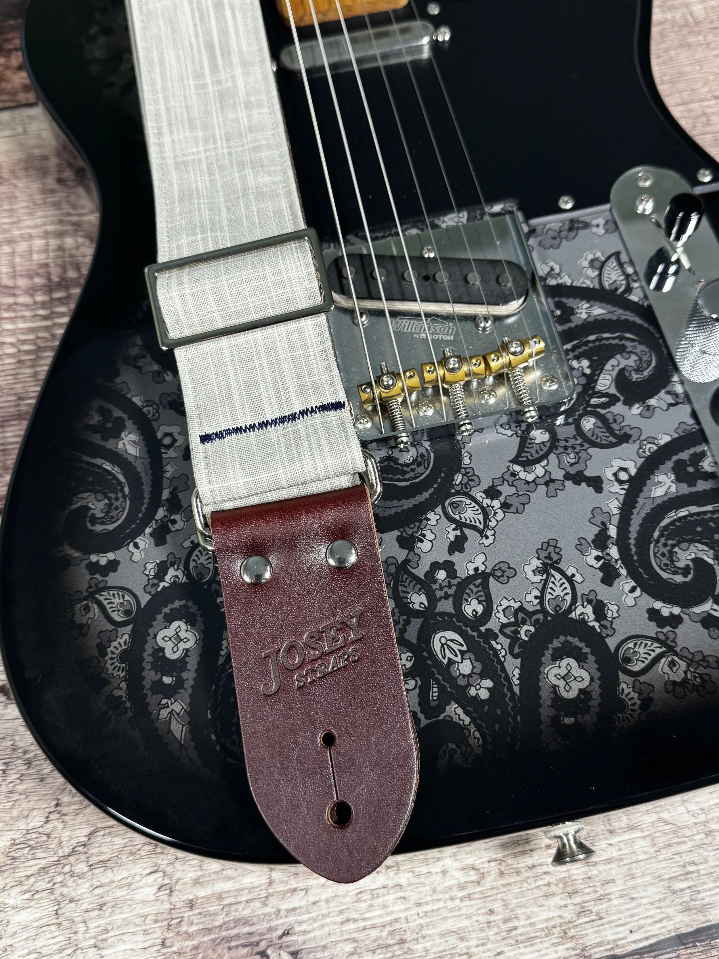Greige handmade guitar strap by Josey Straps featuring a neutral gray-beige woven fabric and premium leather ends.