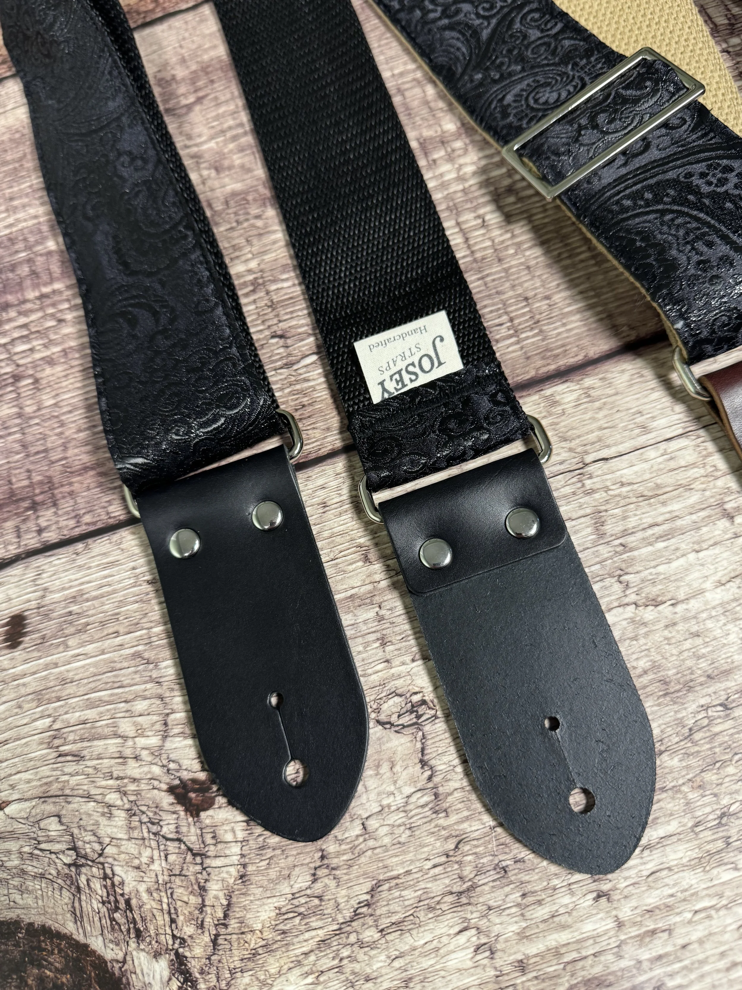 Black textured guitar strap with leather ends by Josey Straps called The Abyss