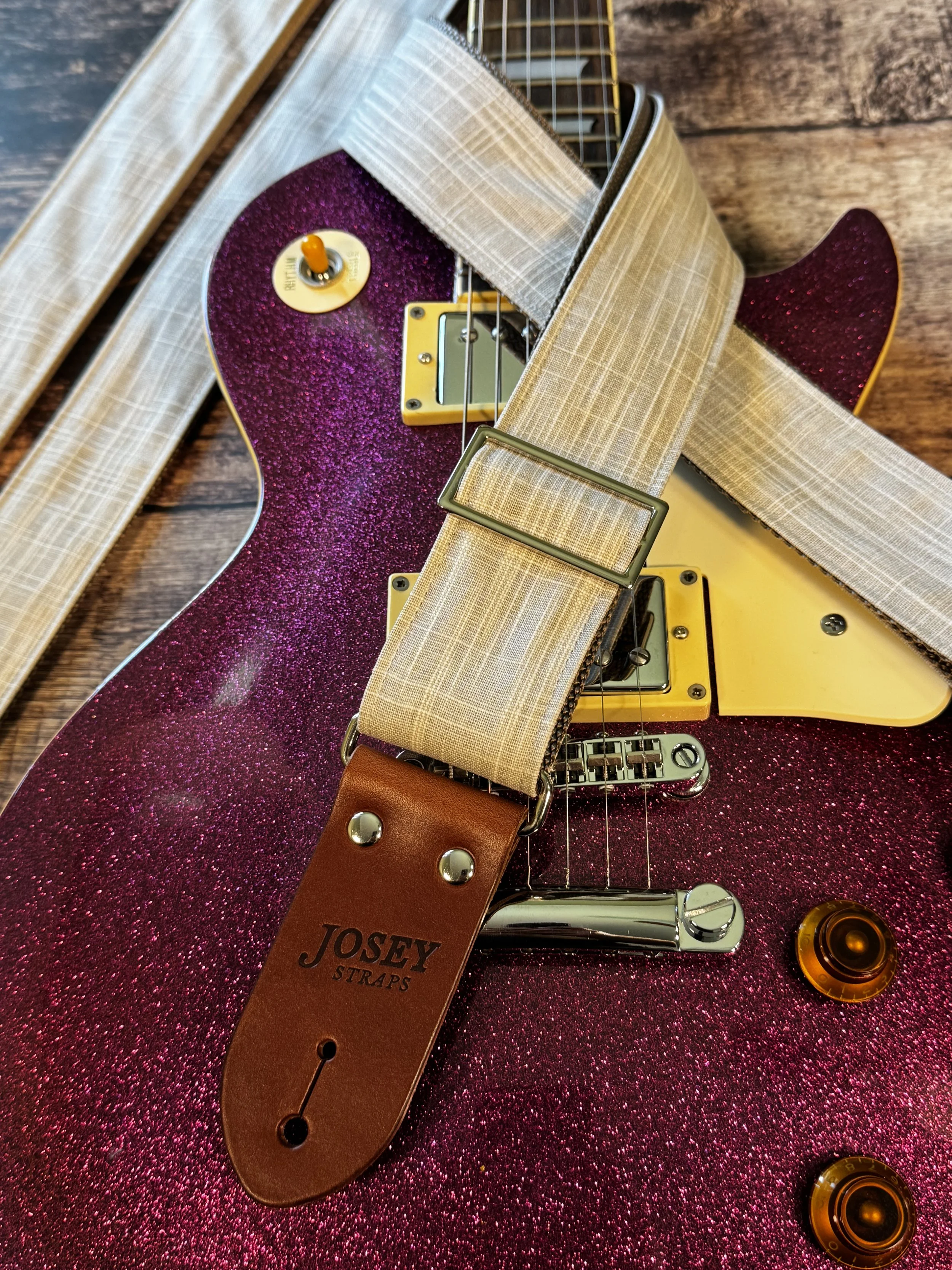 Greige handmade guitar strap by Josey Straps featuring a neutral gray-beige woven fabric and premium leather ends.