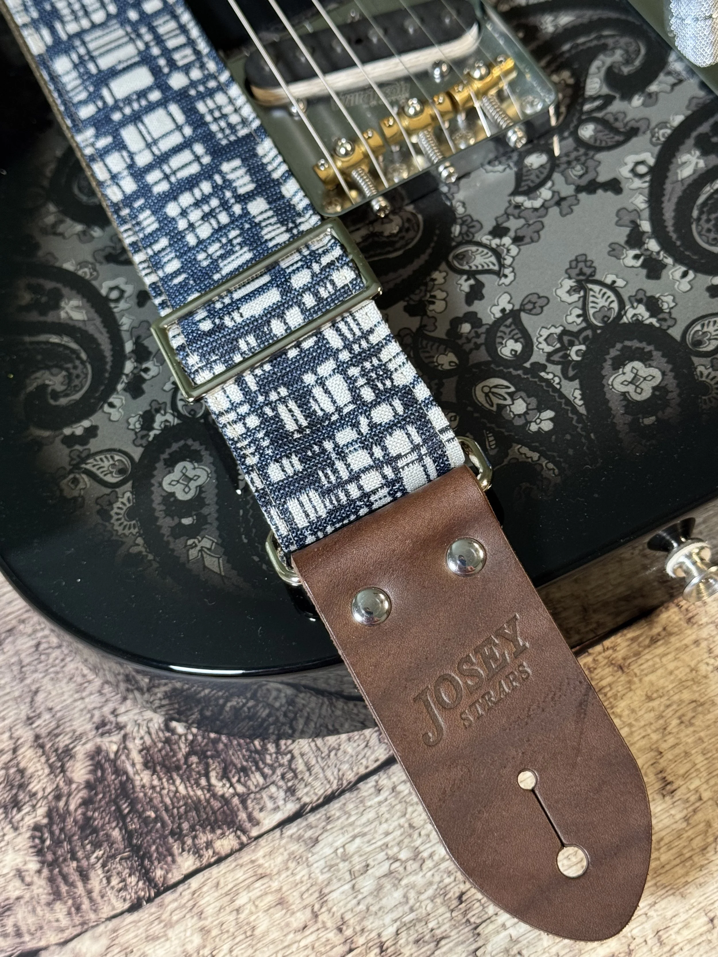 Blueprint guitar strap with blue and white crosshatch pattern and leather ends by Josey Straps.