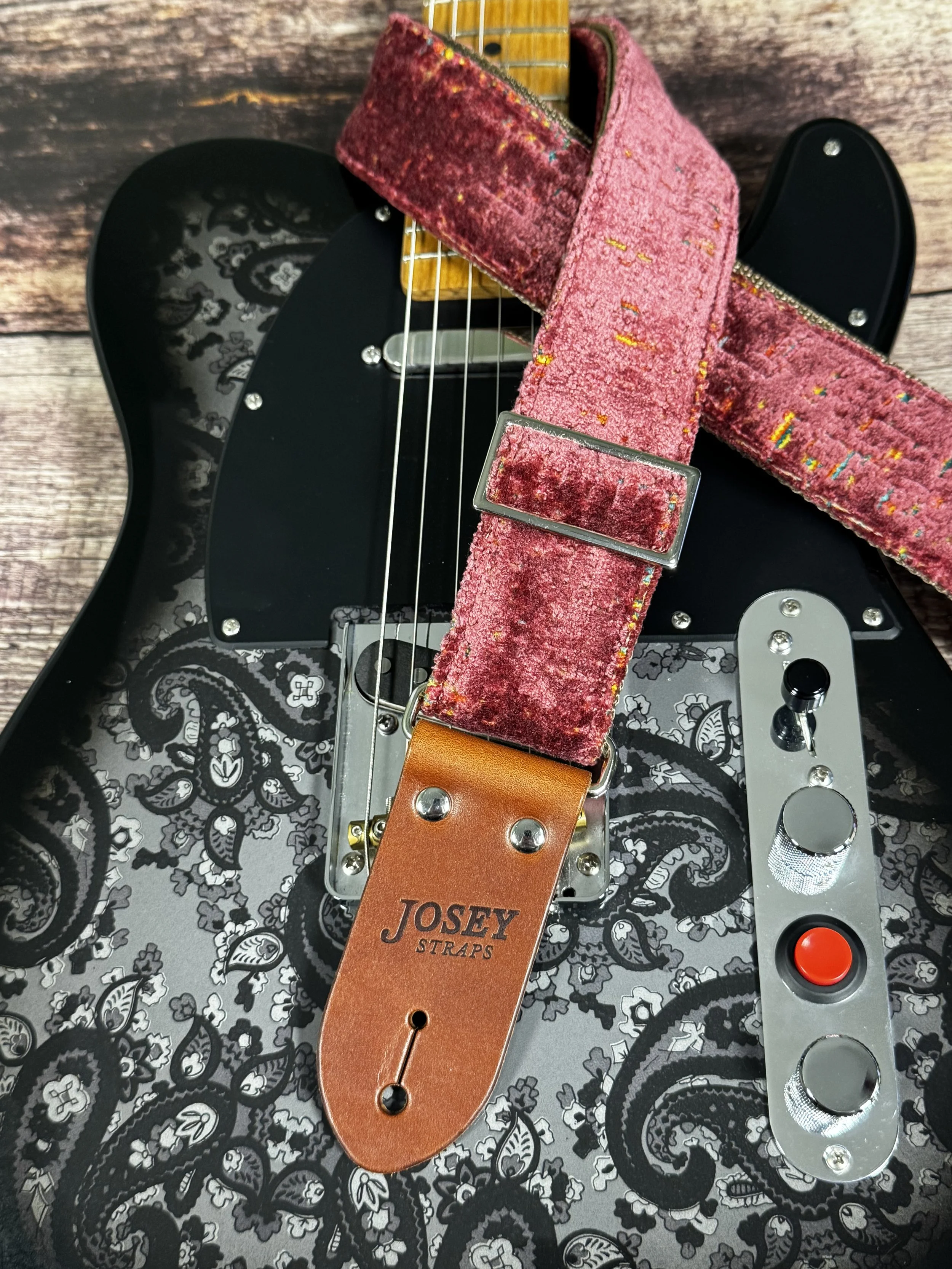 Telly handmade pink guitar strap by Josey Straps featuring textured dusty-rose fabric with colorful flecks and premium leather ends.