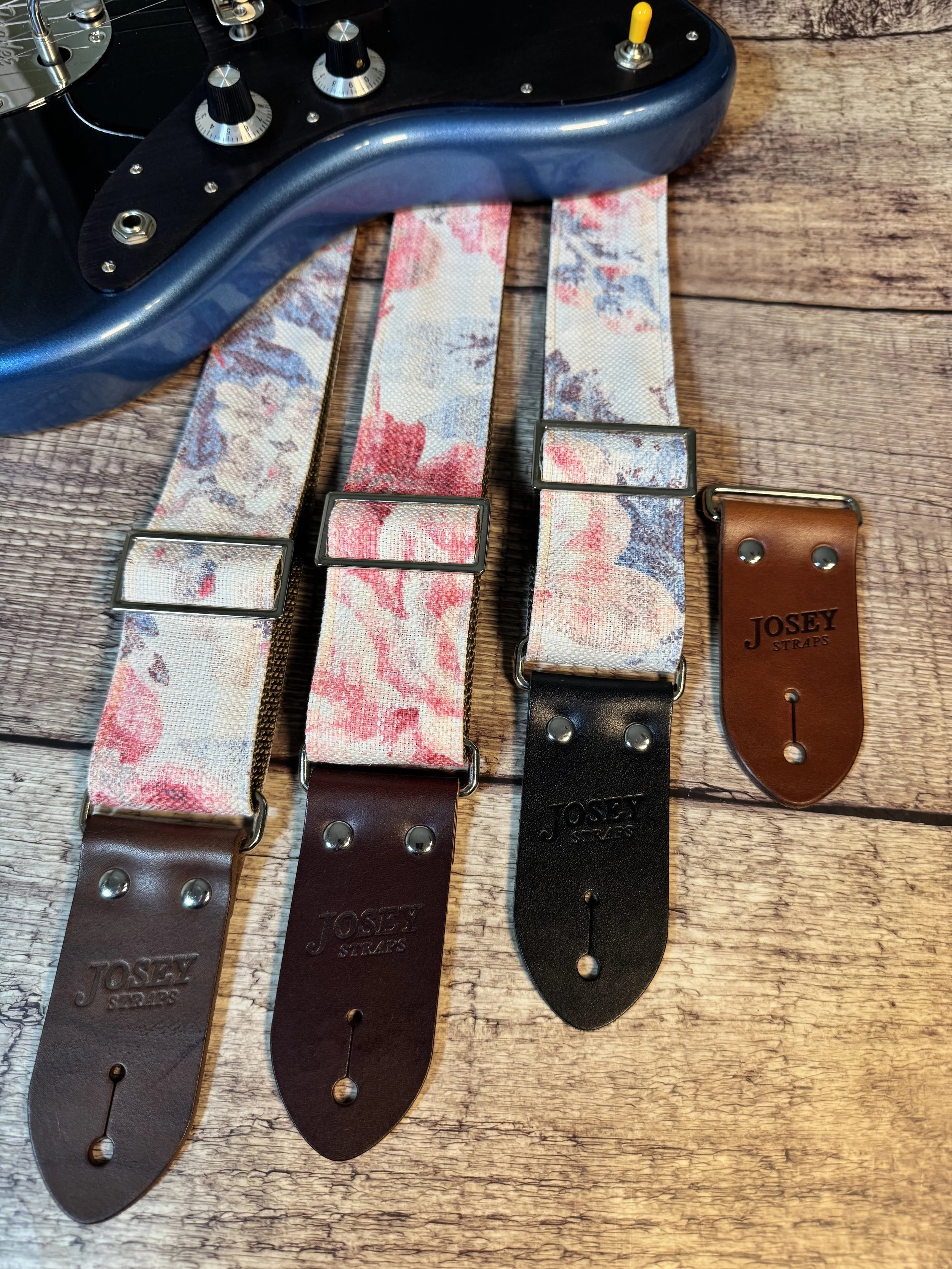 Kensington handmade floral guitar strap by Josey Straps with watercolor pink and blue floral fabric and premium leather ends.