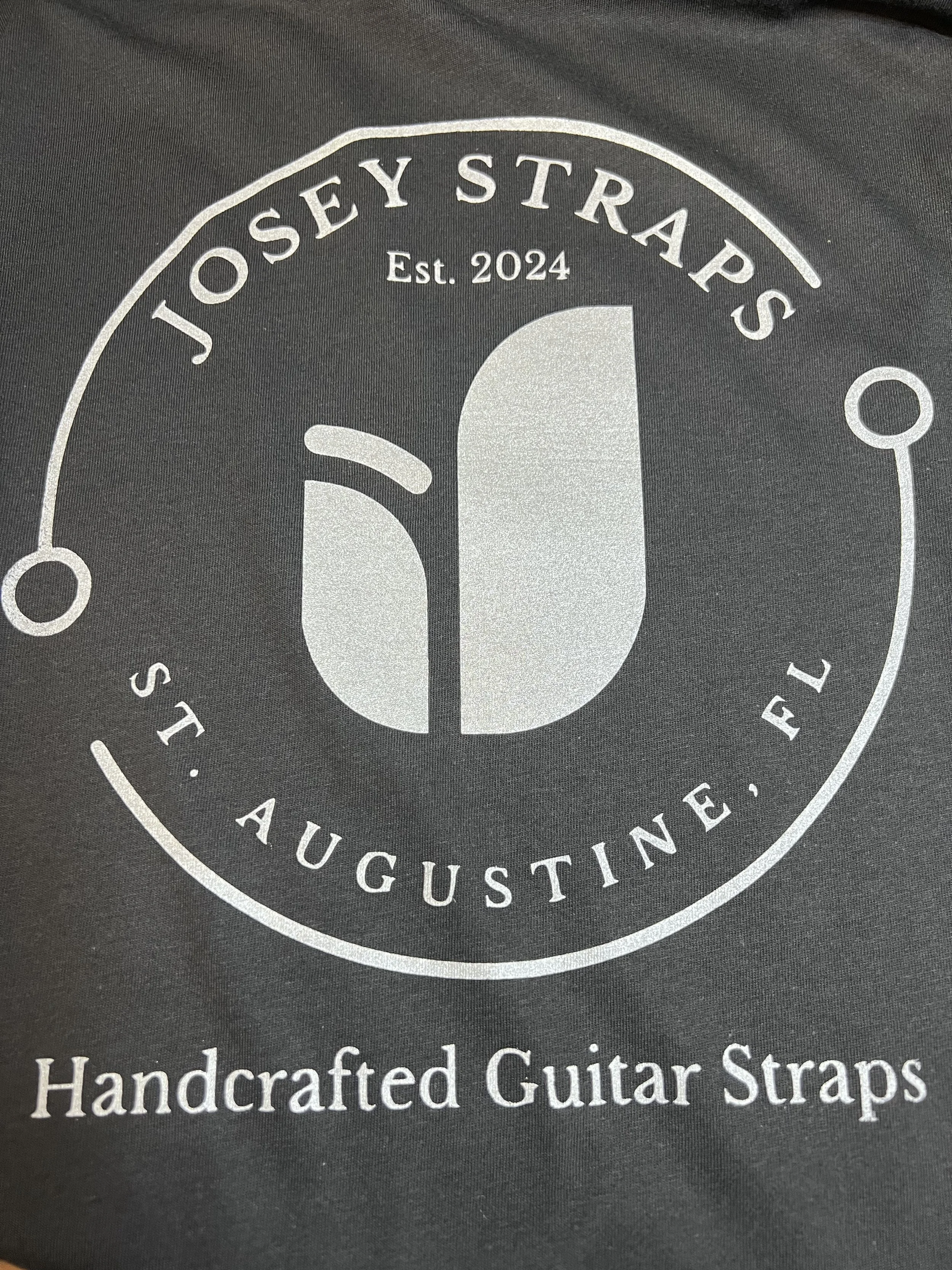 Close up picture of a Josey Straps vintage black screen printed t-shirt.