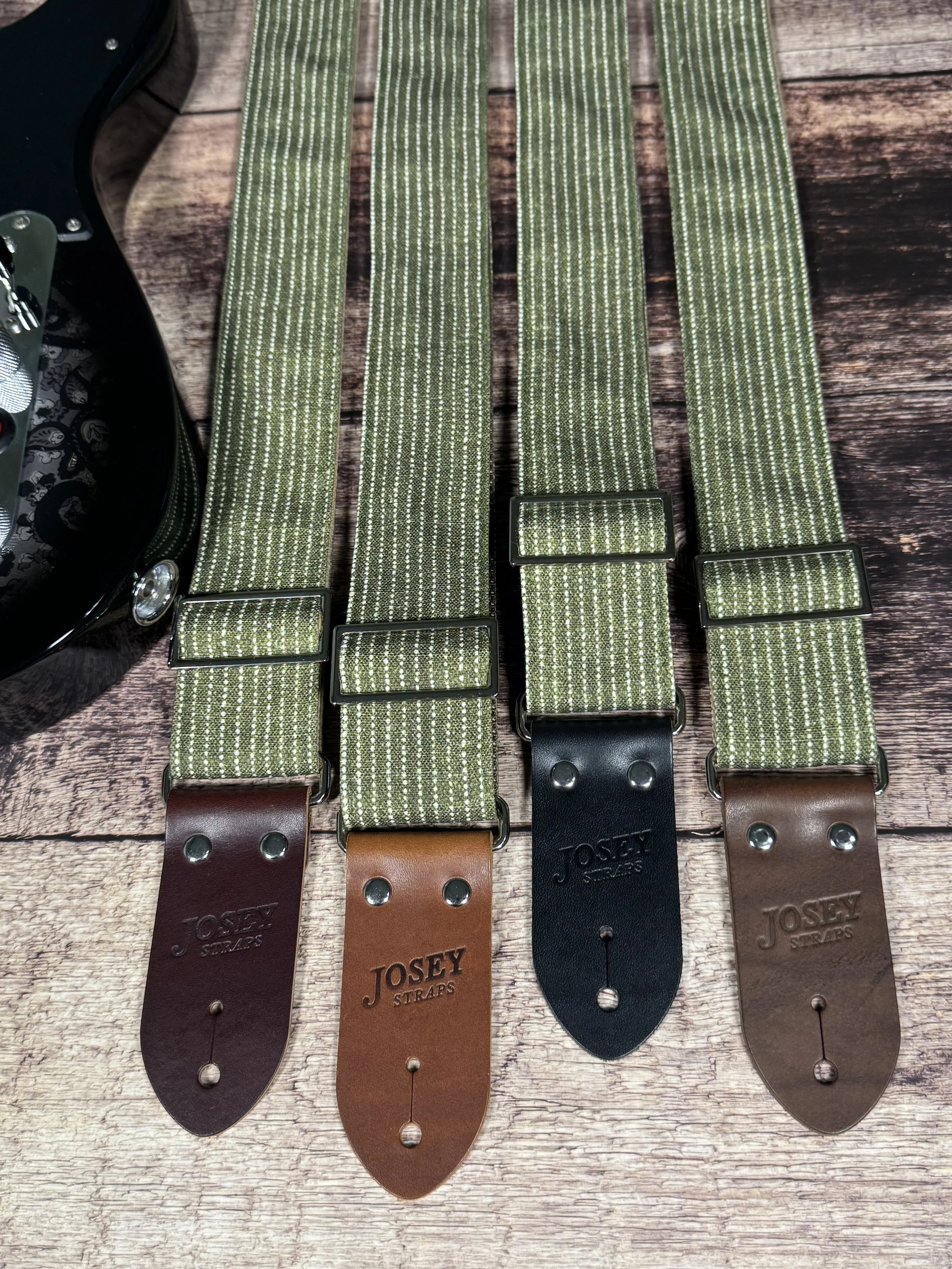 Olive green woven guitar strap with subtle stripe pattern and leather ends by Josey Straps, Mr. Green Jeans design