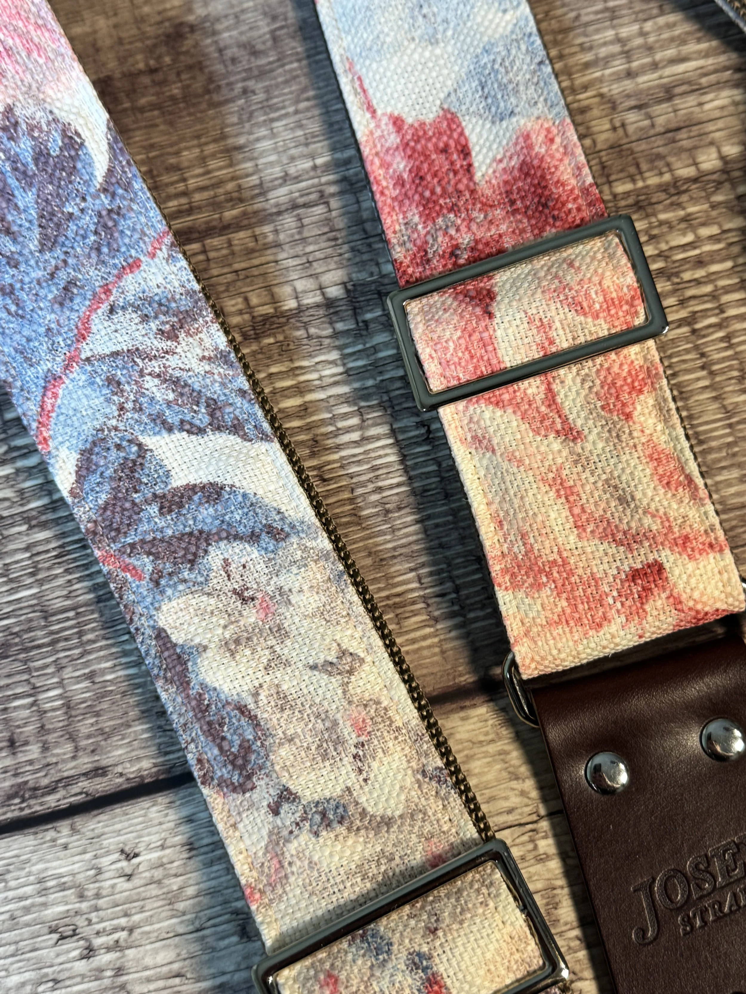 Kensington handmade floral guitar strap by Josey Straps with watercolor pink and blue floral fabric and premium leather ends.