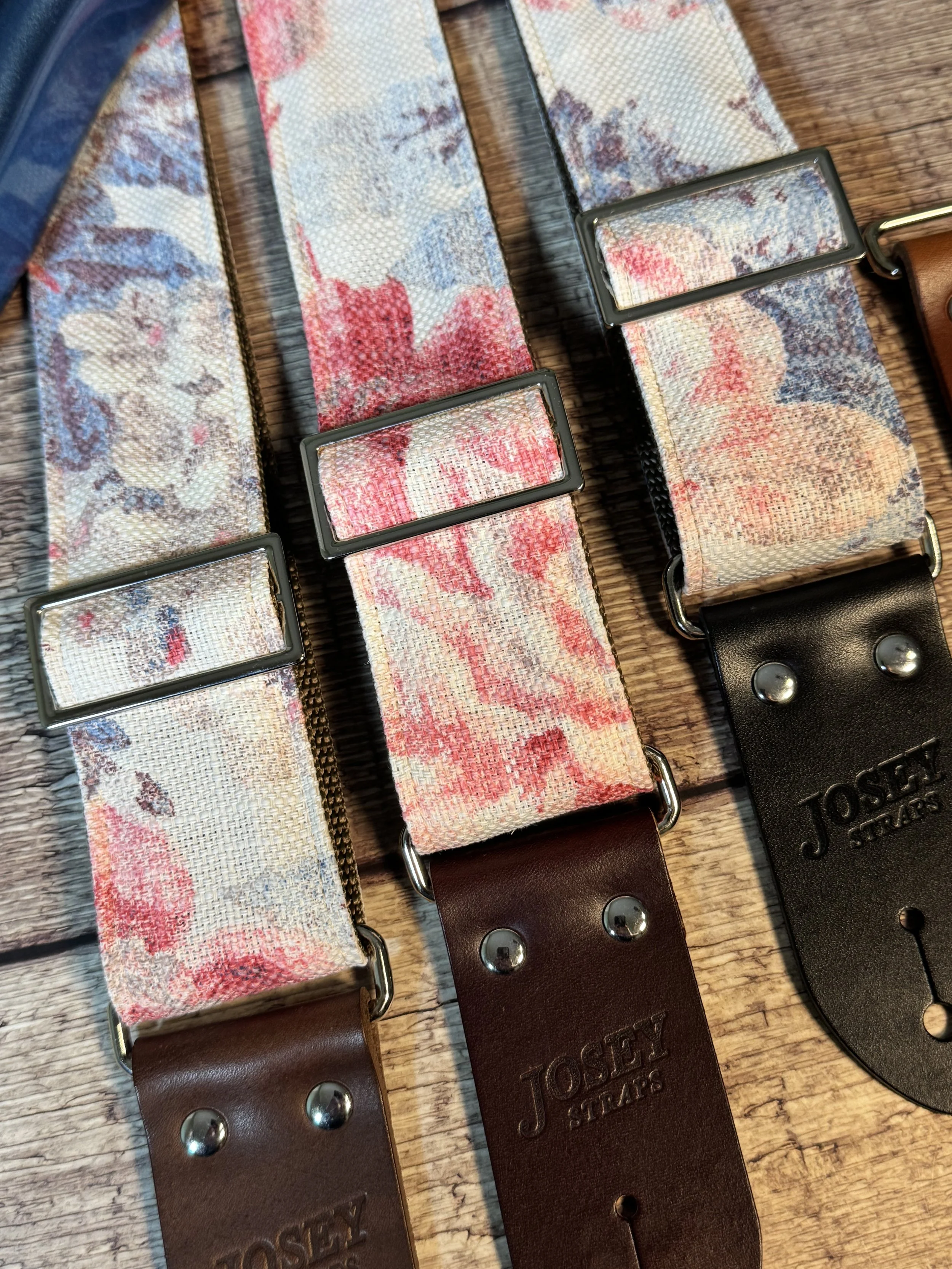 Kensington handmade floral guitar strap by Josey Straps with watercolor pink and blue floral fabric and premium leather ends.