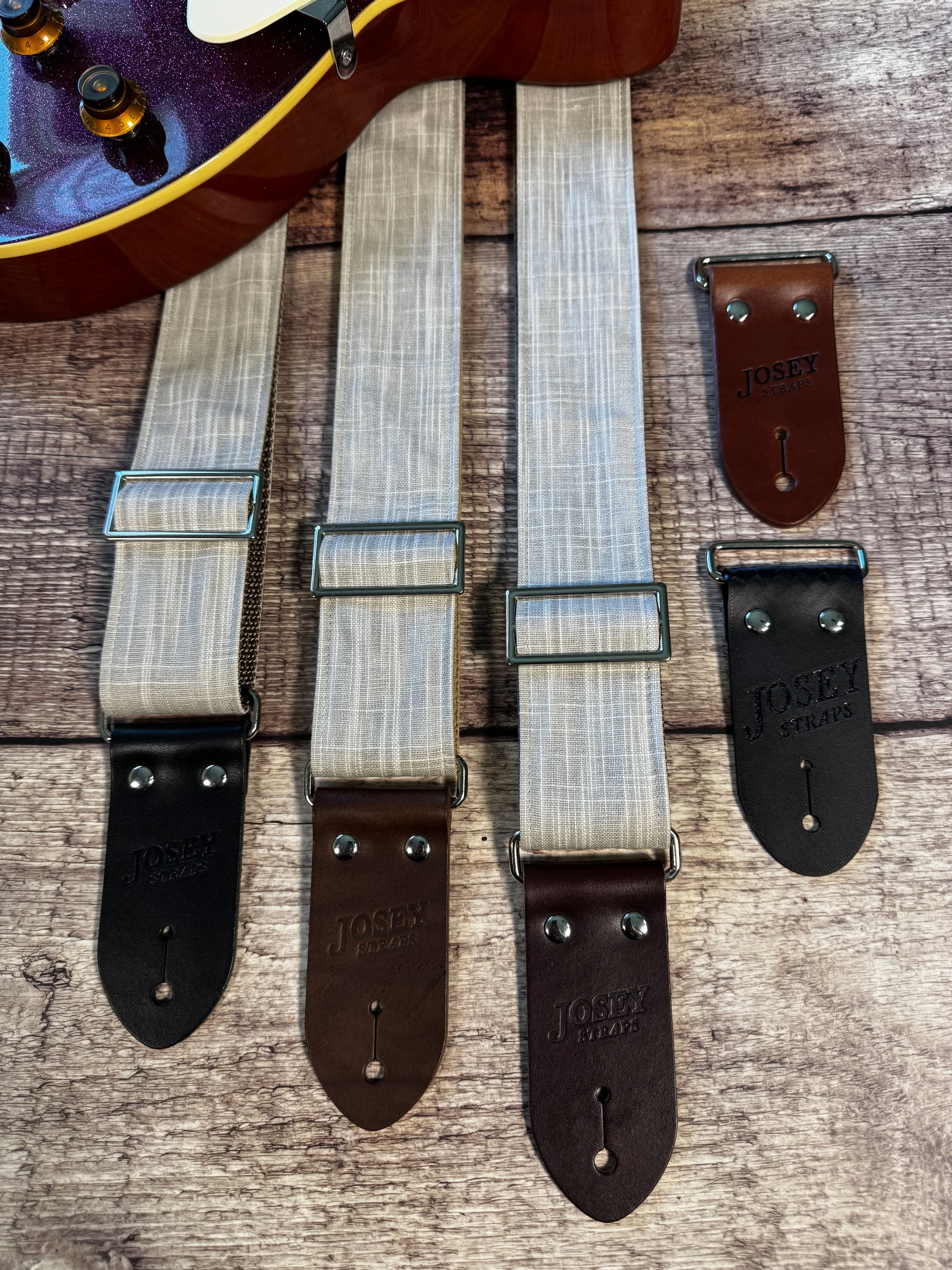 Greige handmade guitar strap by Josey Straps featuring a neutral gray-beige woven fabric and premium leather ends.