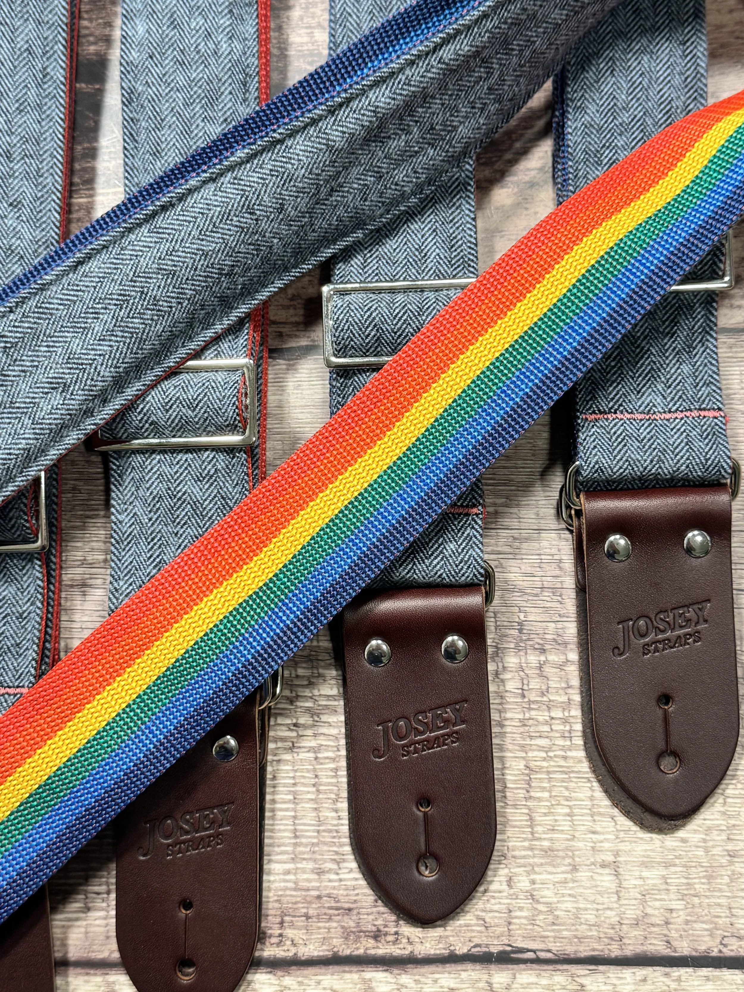 Ally limited-edition guitar strap featuring blue-on-blue herringbone flannel, rainbow backing, and Sunset leather ends by Josey Straps