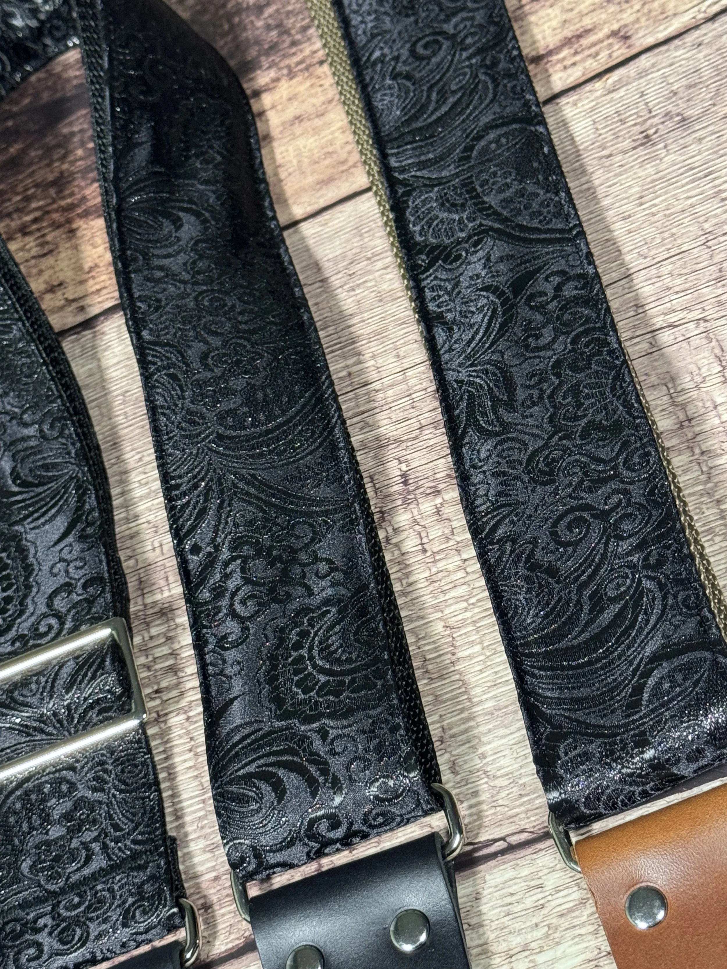 Black textured guitar strap with leather ends by Josey Straps called The Abyss