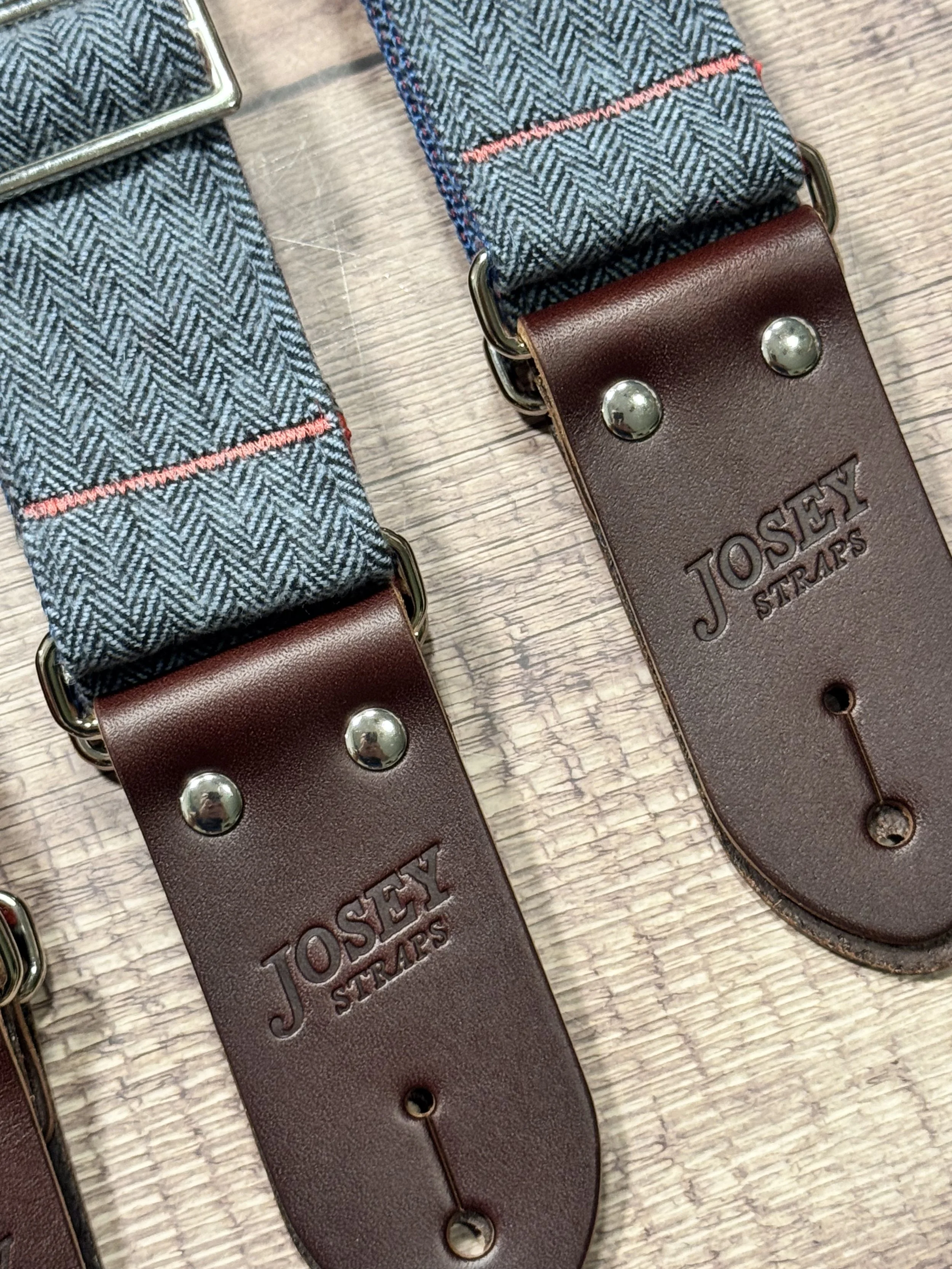 Ally limited-edition guitar strap featuring blue-on-blue herringbone flannel, rainbow backing, and Sunset leather ends by Josey Straps