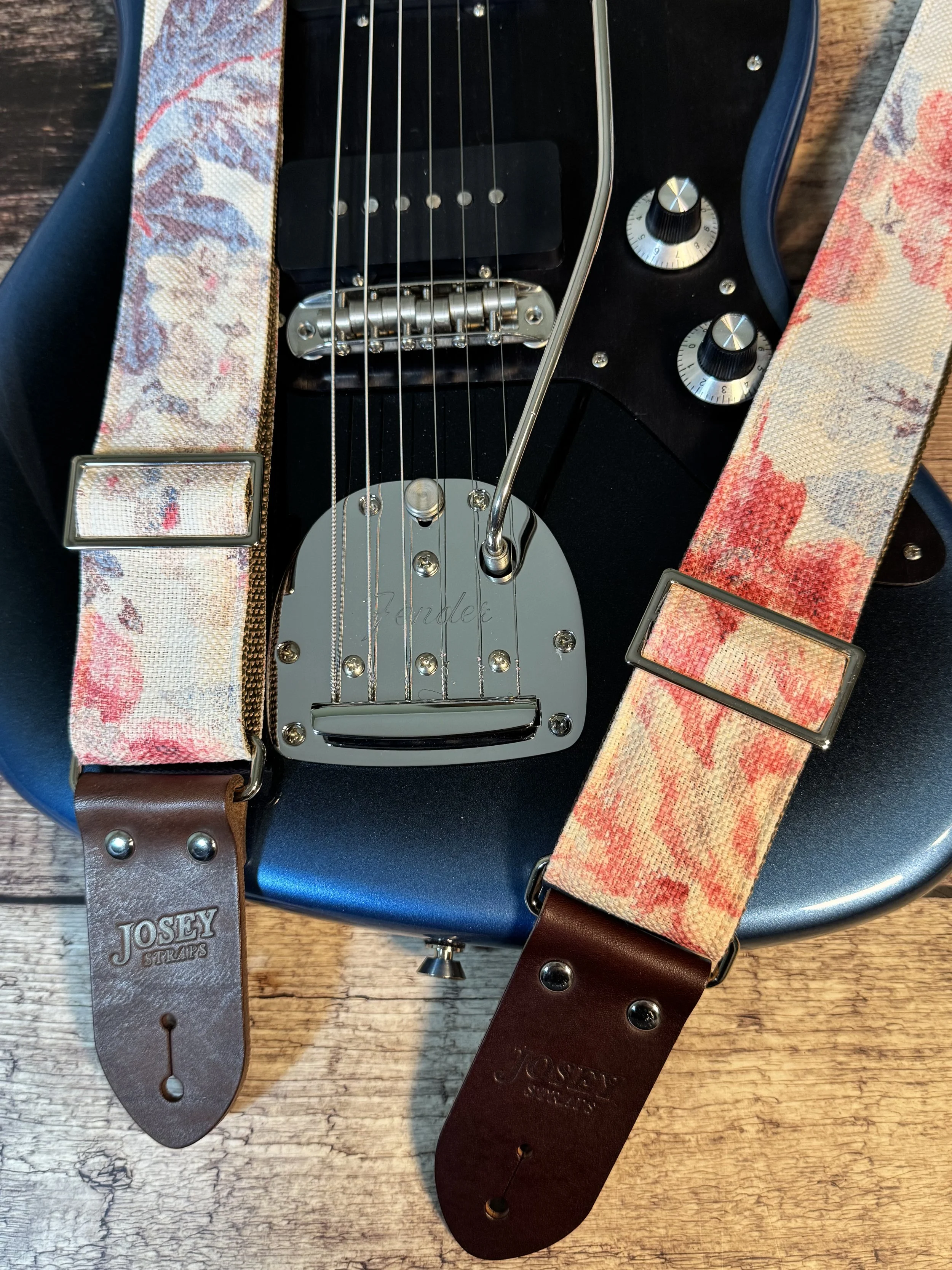 Kensington handmade floral guitar strap by Josey Straps with watercolor pink and blue floral fabric and premium leather ends.