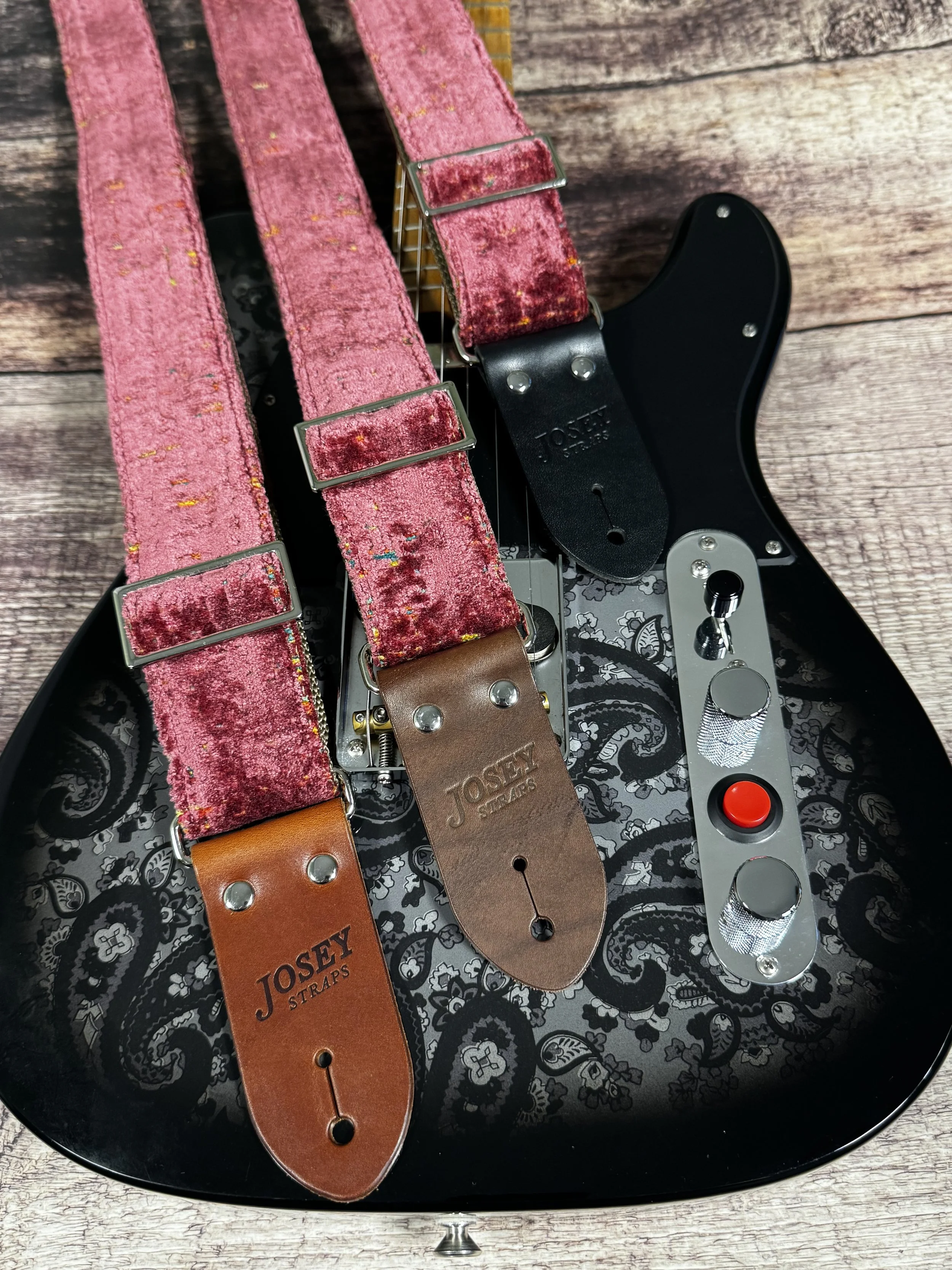 Telly handmade pink guitar strap by Josey Straps featuring textured dusty-rose fabric with colorful flecks and premium leather ends.