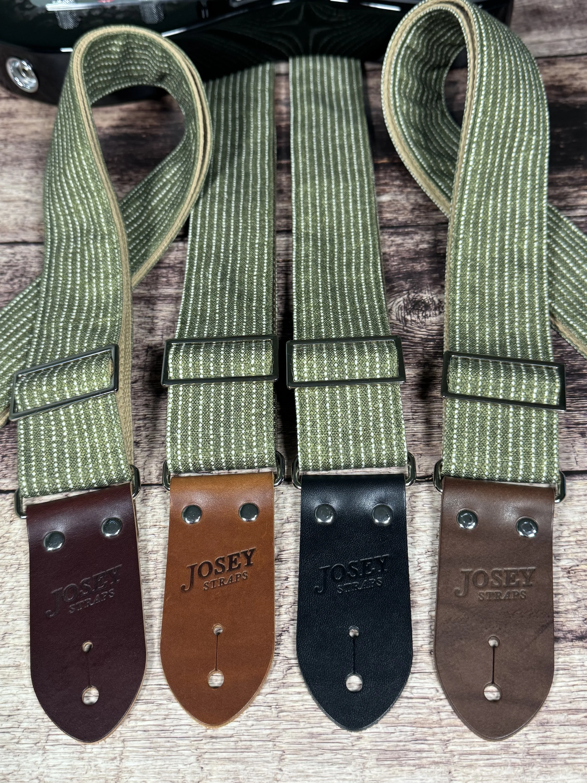 Olive green woven guitar strap with subtle stripe pattern and leather ends by Josey Straps, Mr. Green Jeans design