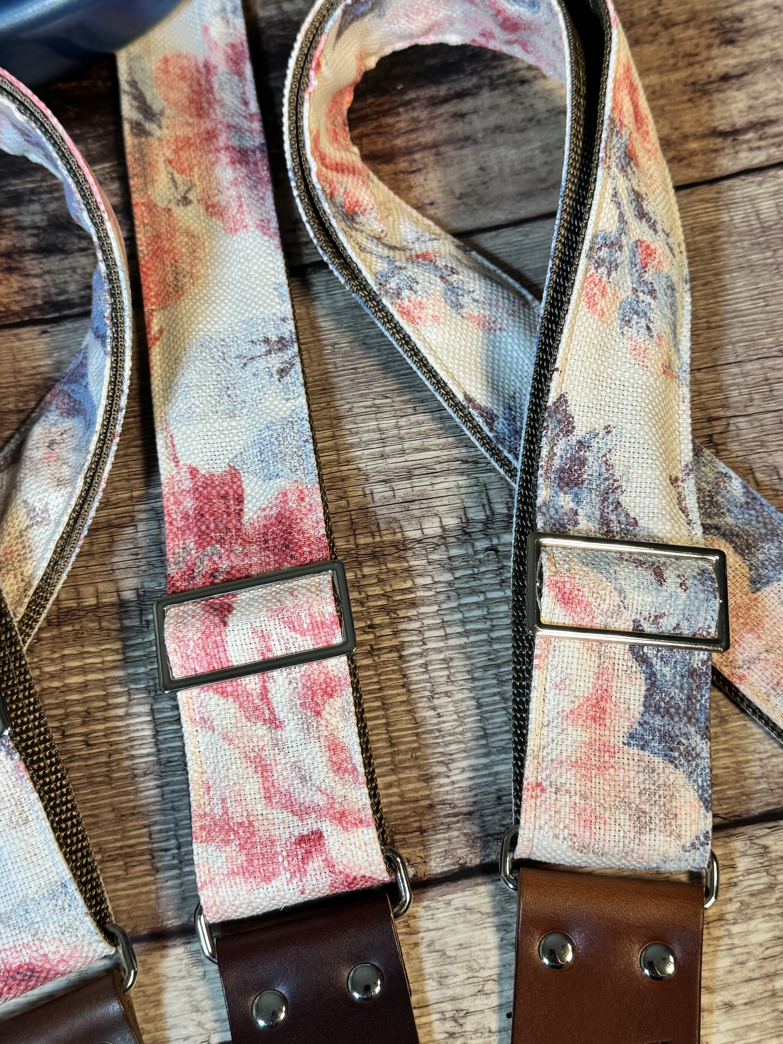 Kensington handmade floral guitar strap by Josey Straps with watercolor pink and blue floral fabric and premium leather ends.