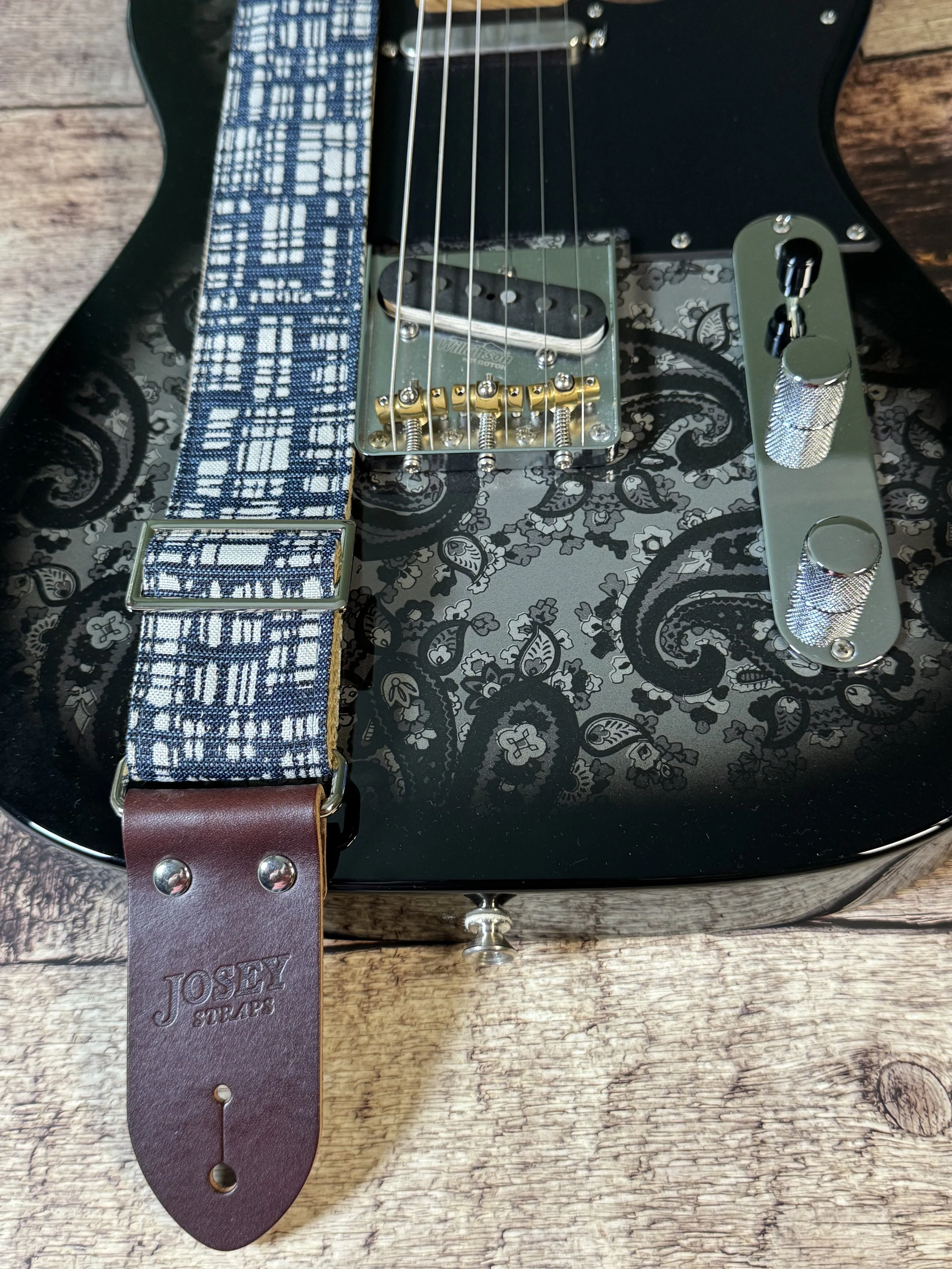 Blueprint guitar strap with blue and white crosshatch pattern and leather ends by Josey Straps.