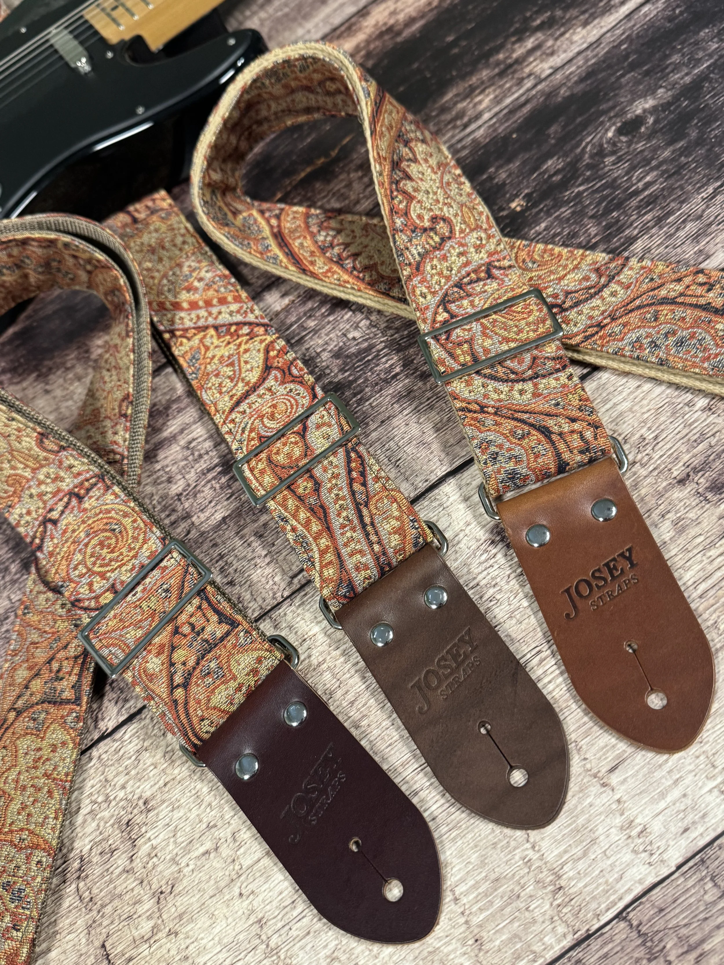 Josey Straps Ottoman guitar strap with vintage paisley tapestry fabric and leather ends.