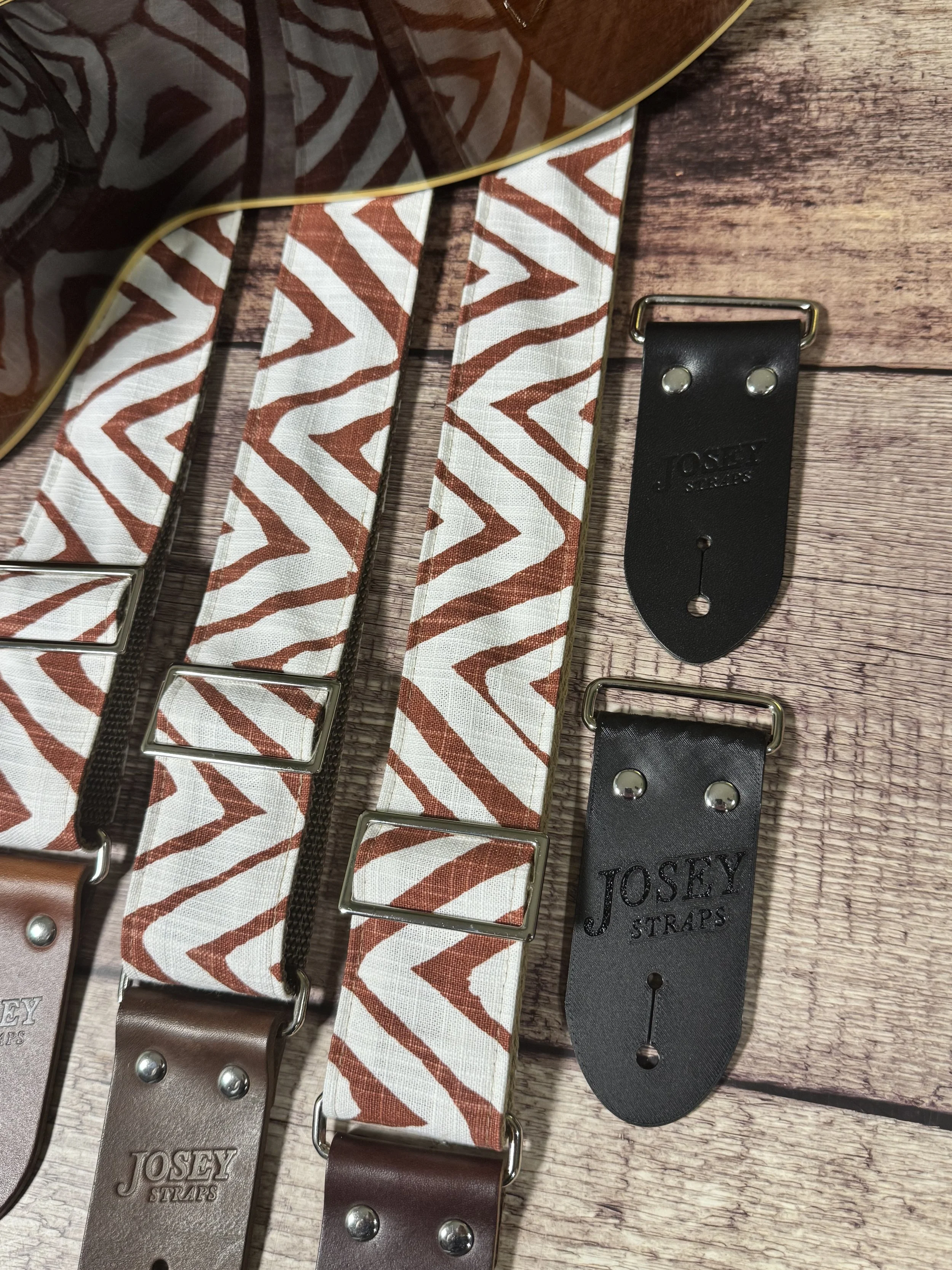 Petroglyph guitar strap featuring an earthy rust and cream geometric pattern by Josey Straps.