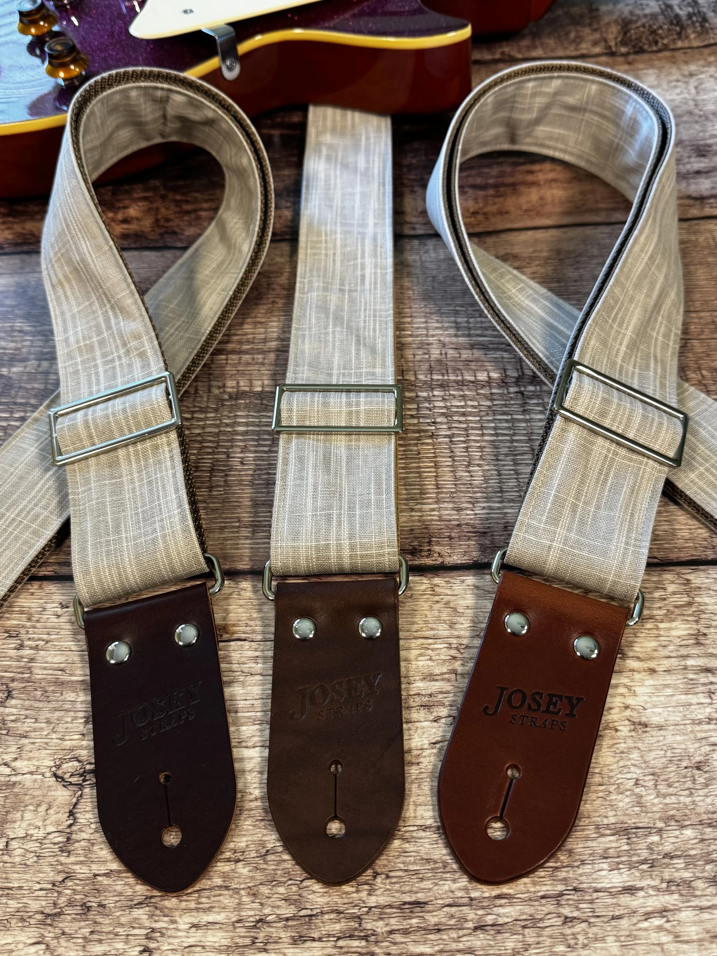 Greige handmade guitar strap by Josey Straps featuring a neutral gray-beige woven fabric and premium leather ends.