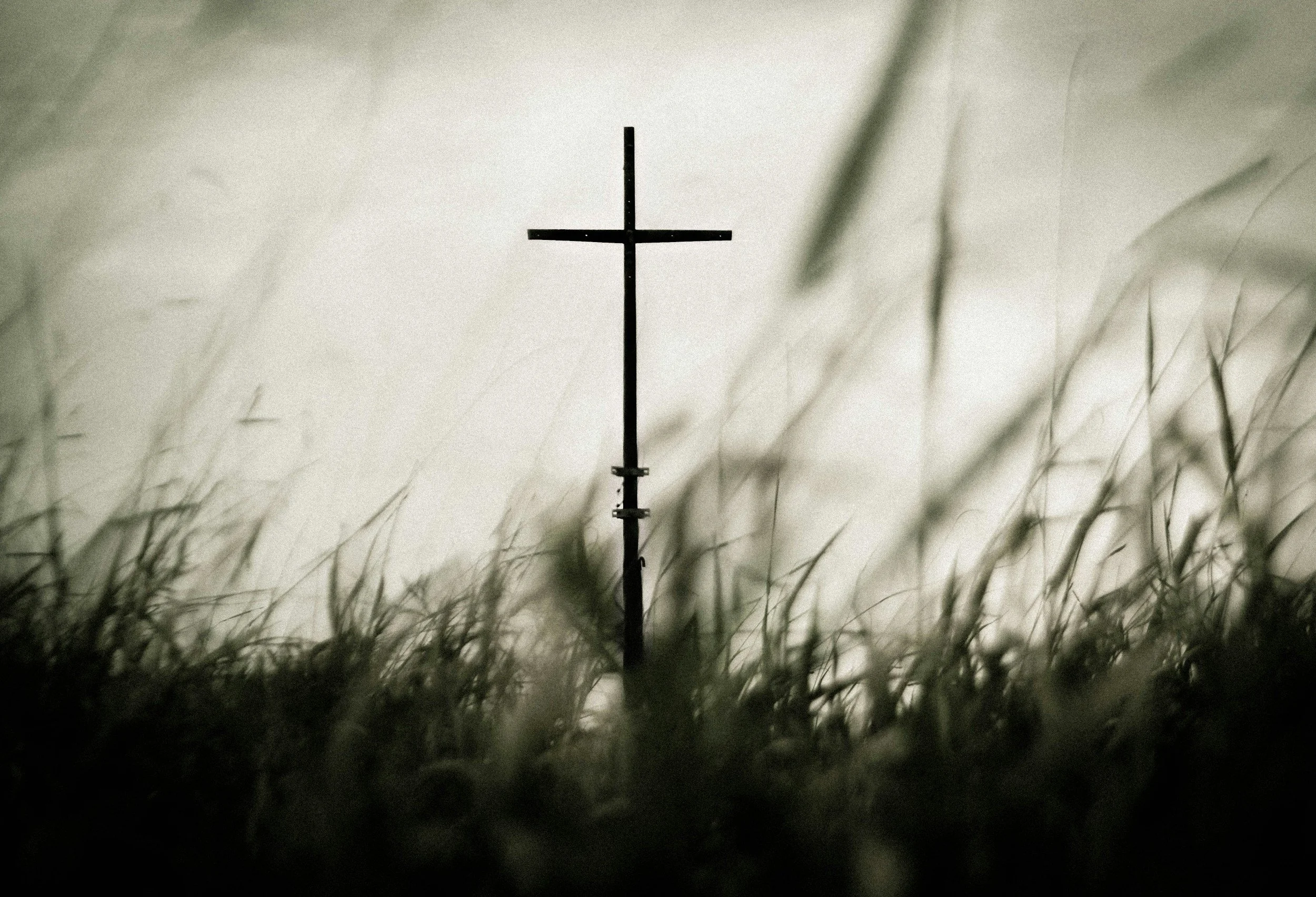 Cross in a grassy field