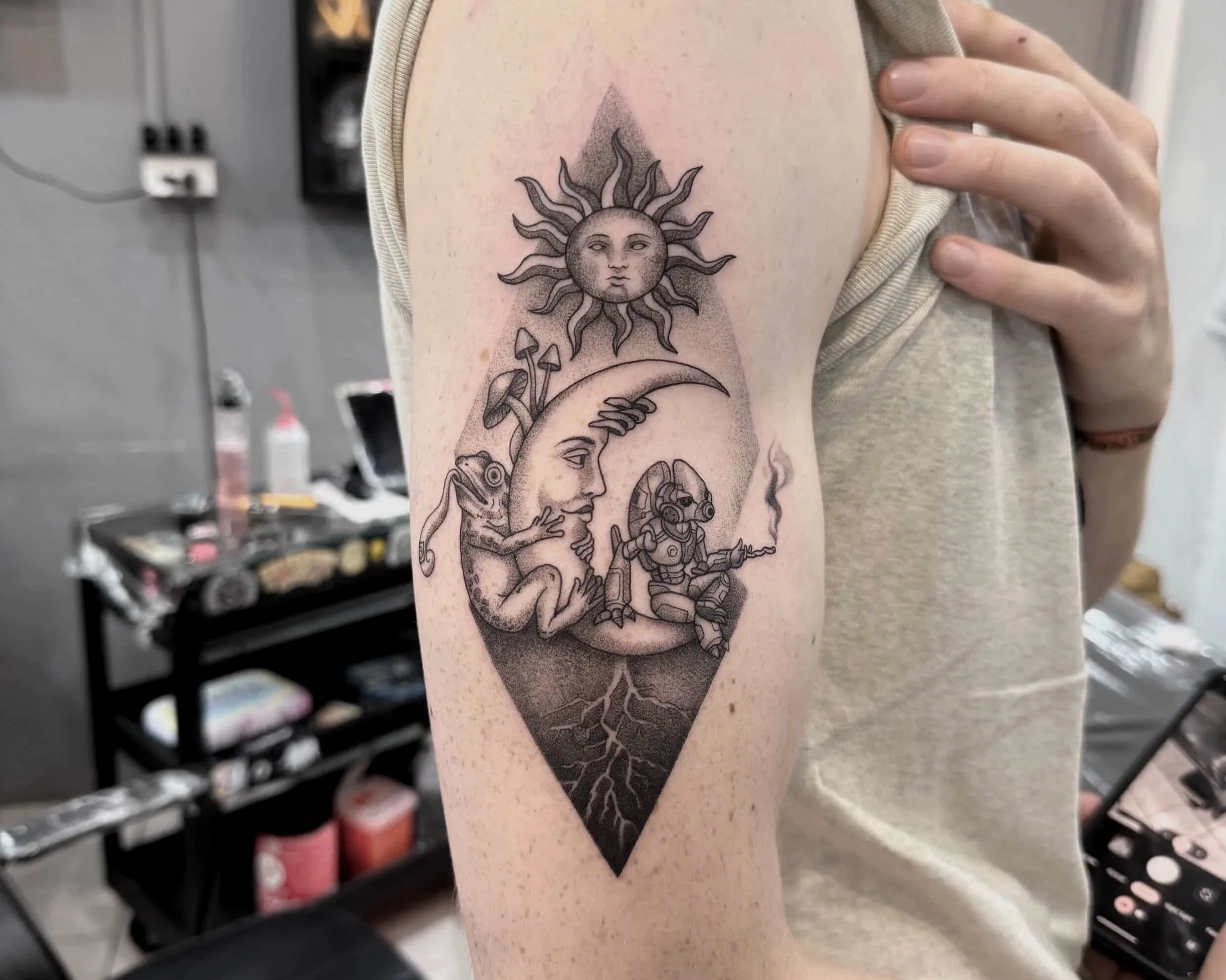 Tattoo of a jellyfish on a person's upper thigh.