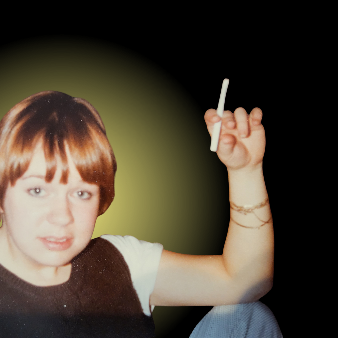 A woman with short brown hair holding a white marker in her raised right hand, wearing a black sleeveless top and a white t-shirt underneath, with a yellow-green gradient background.