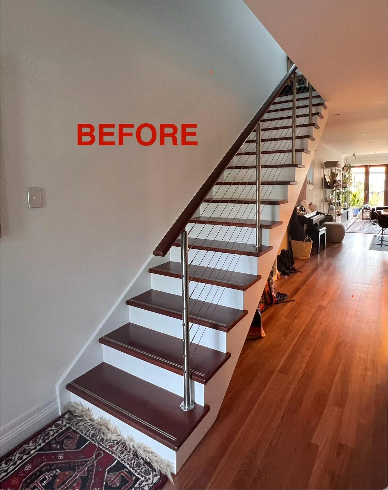 Under stairs area with exposed staircase and no built-in cabinetry or storage
