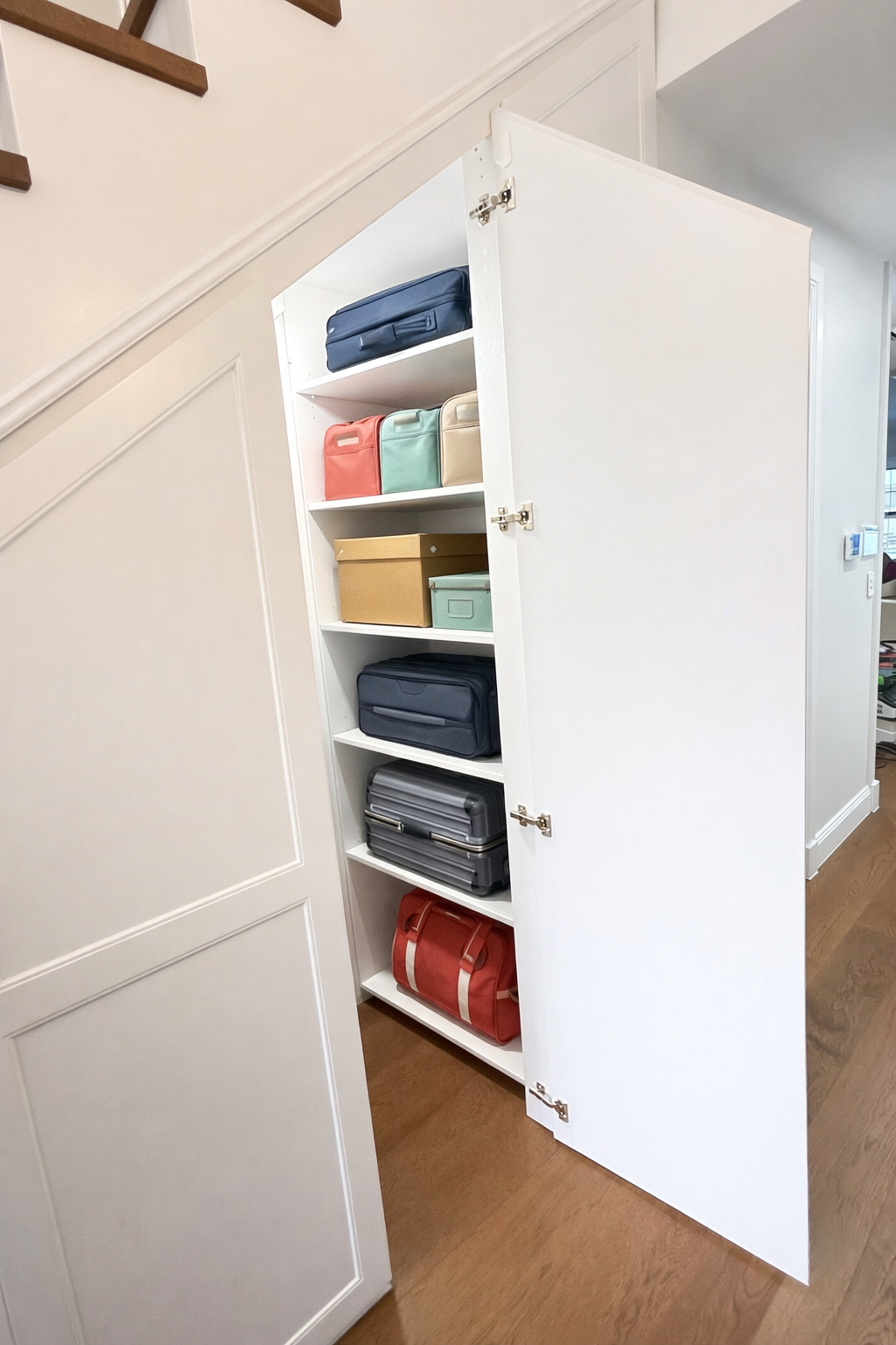 Custom under stairs cabinetry with shaker panels and built-in storage beneath staircase in Sydney home