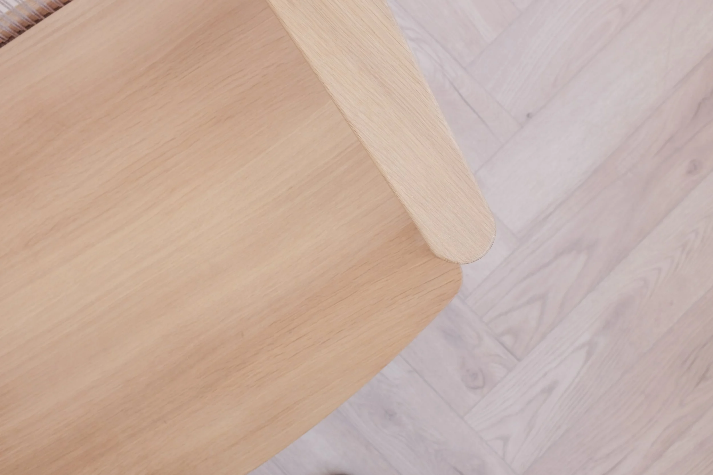 Armrest and seat of solid oak easy chair.