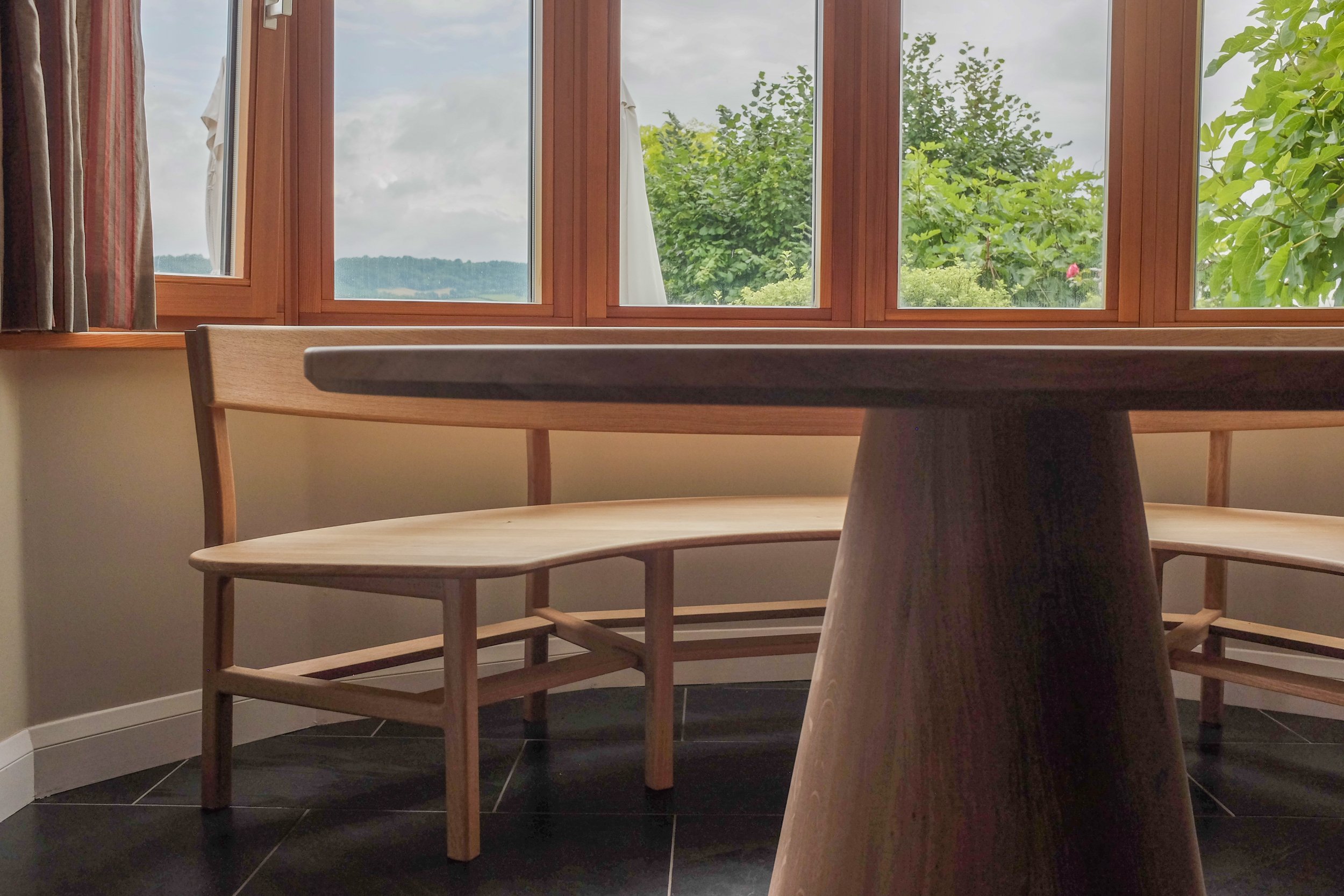 Chamfered edge detail of the solid oak Wye dining table.