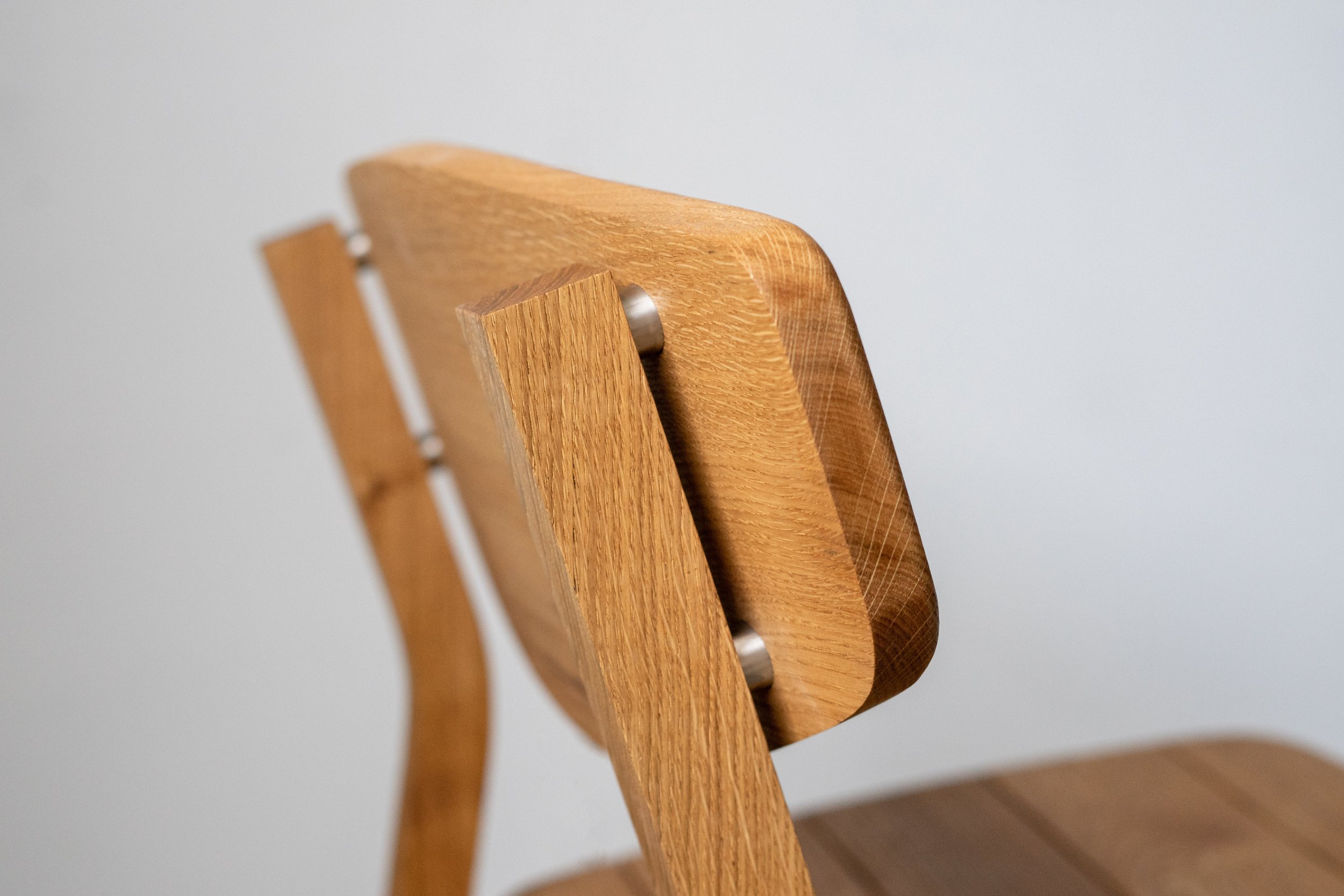 Close up view of the backrest connection on the Kennet oak garden chair.