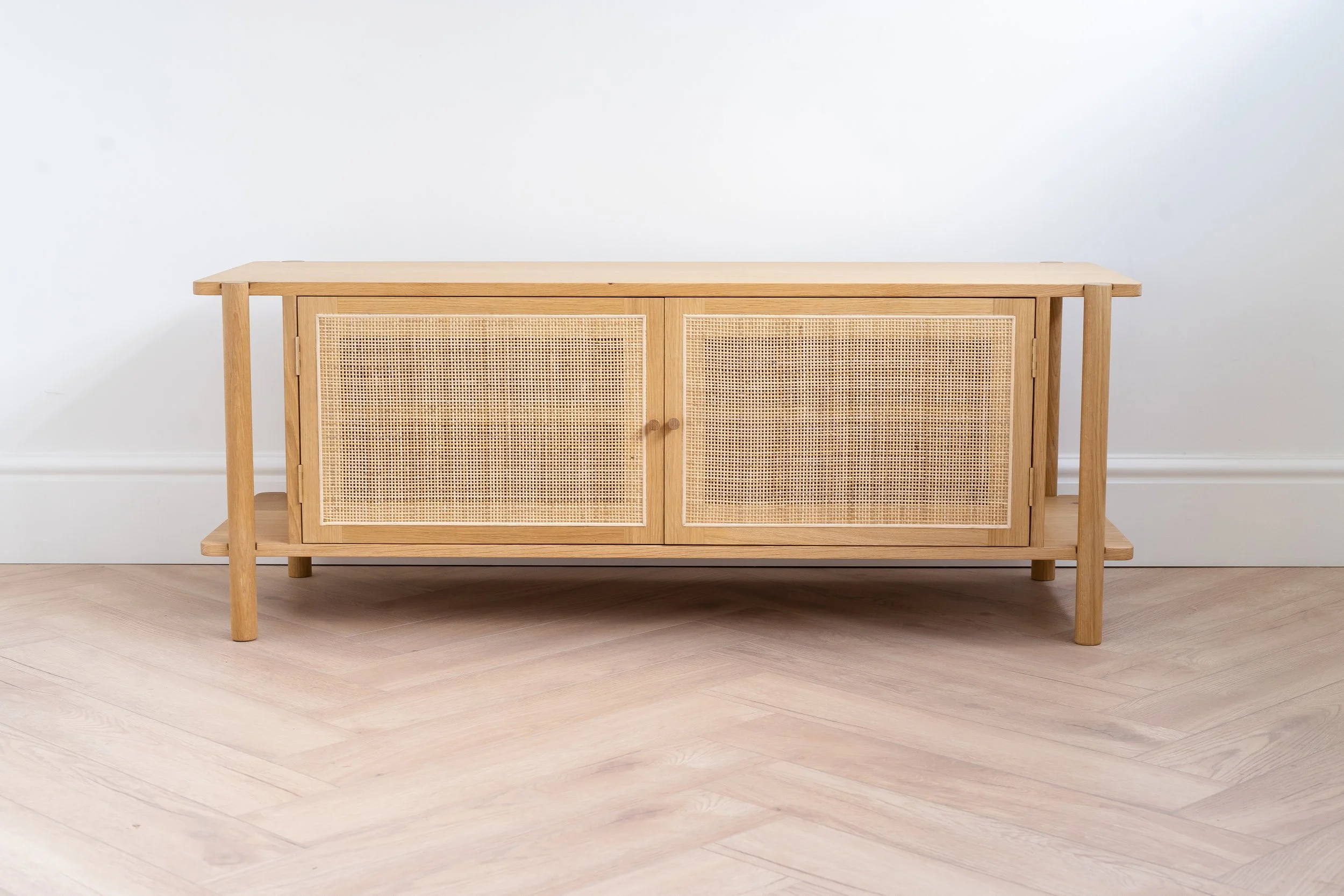 Large light coloured oak Sideboard with woven rattan cane doors.