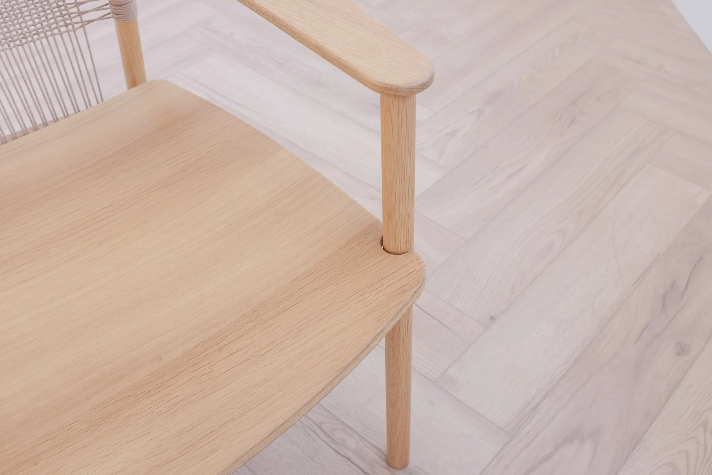 Seat with cut away detail for leg and armrest.