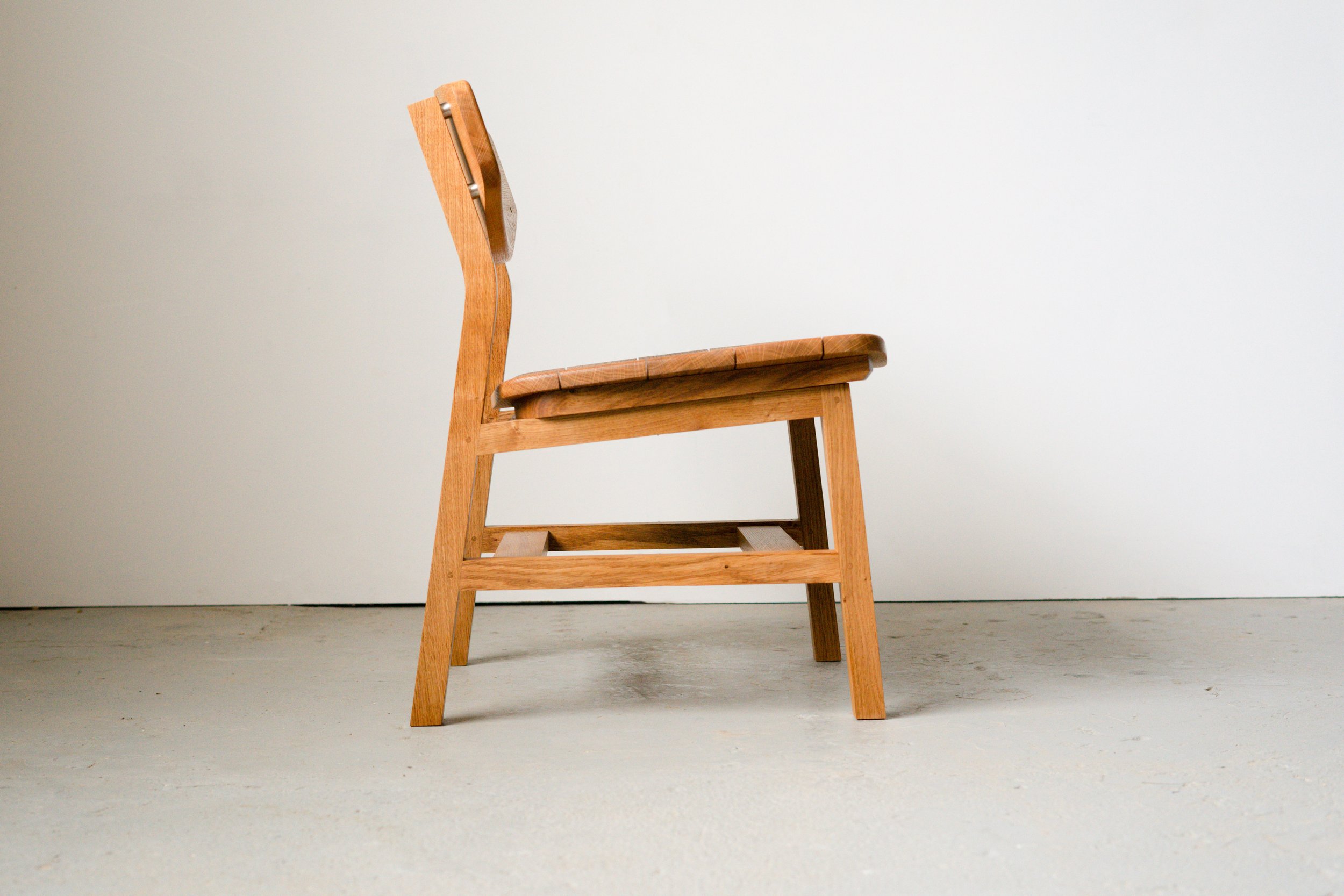 Side angle of the Kennet chair, a solid oak garden chair