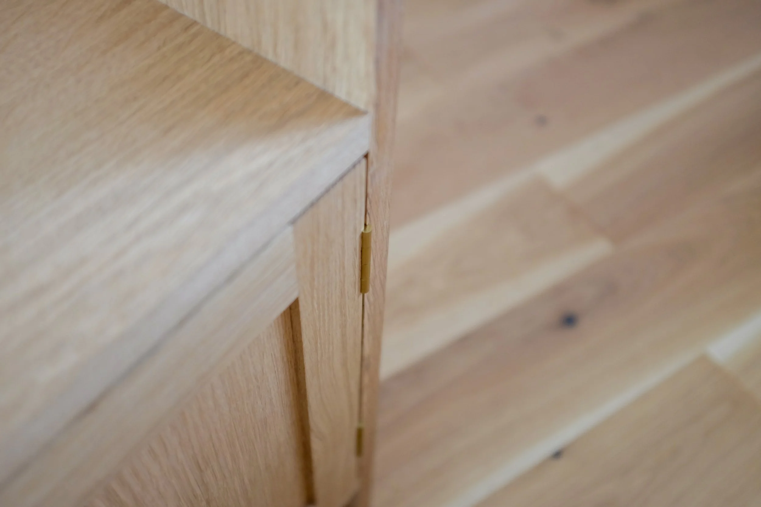 Traditional brass butt hinges on shaker door.