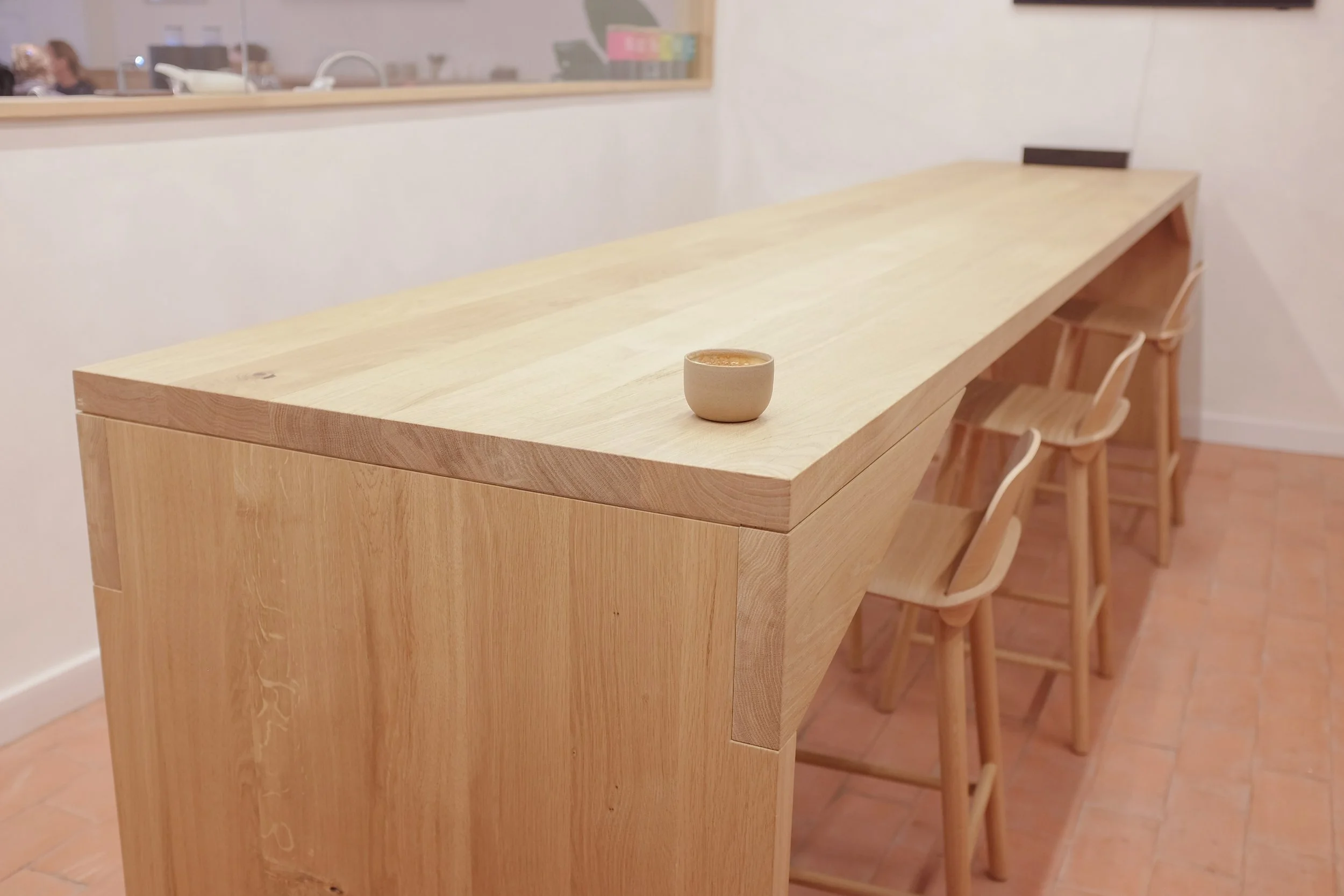 The Origin Bench, four metre long conference table in solid oak with a coffee.