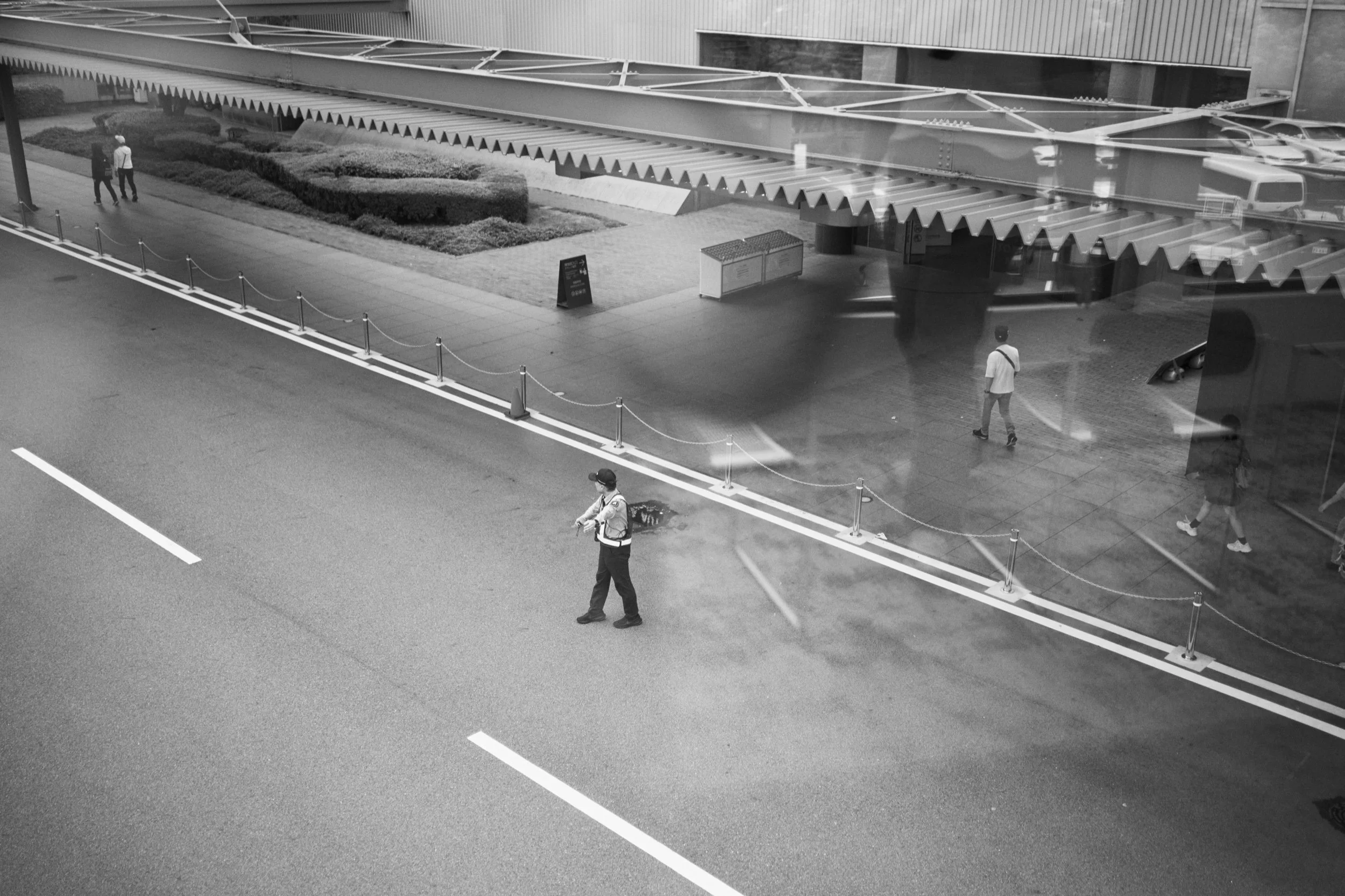 A parking attendant outside the Toyota Automobile Museum. Nisshin.