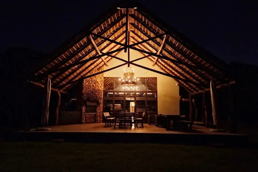 Berendina Wildplaas lodge at night by outside fire place