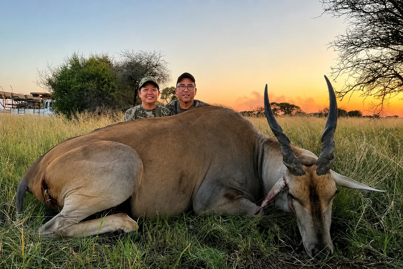 Lady and male client posing with Eland bull from Hunt at Berendina Wildsplaas