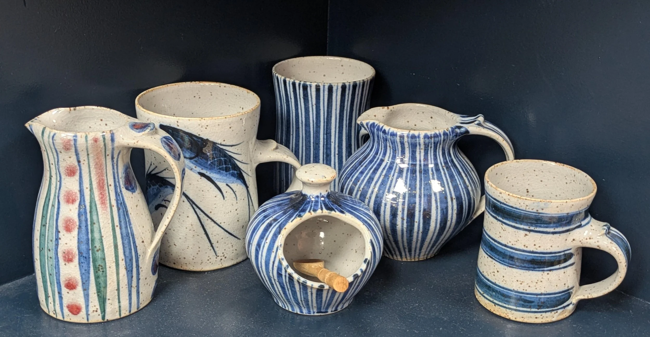 Artisanal ceramic pitchers, mugs, pots and cups with hand painted patterns 