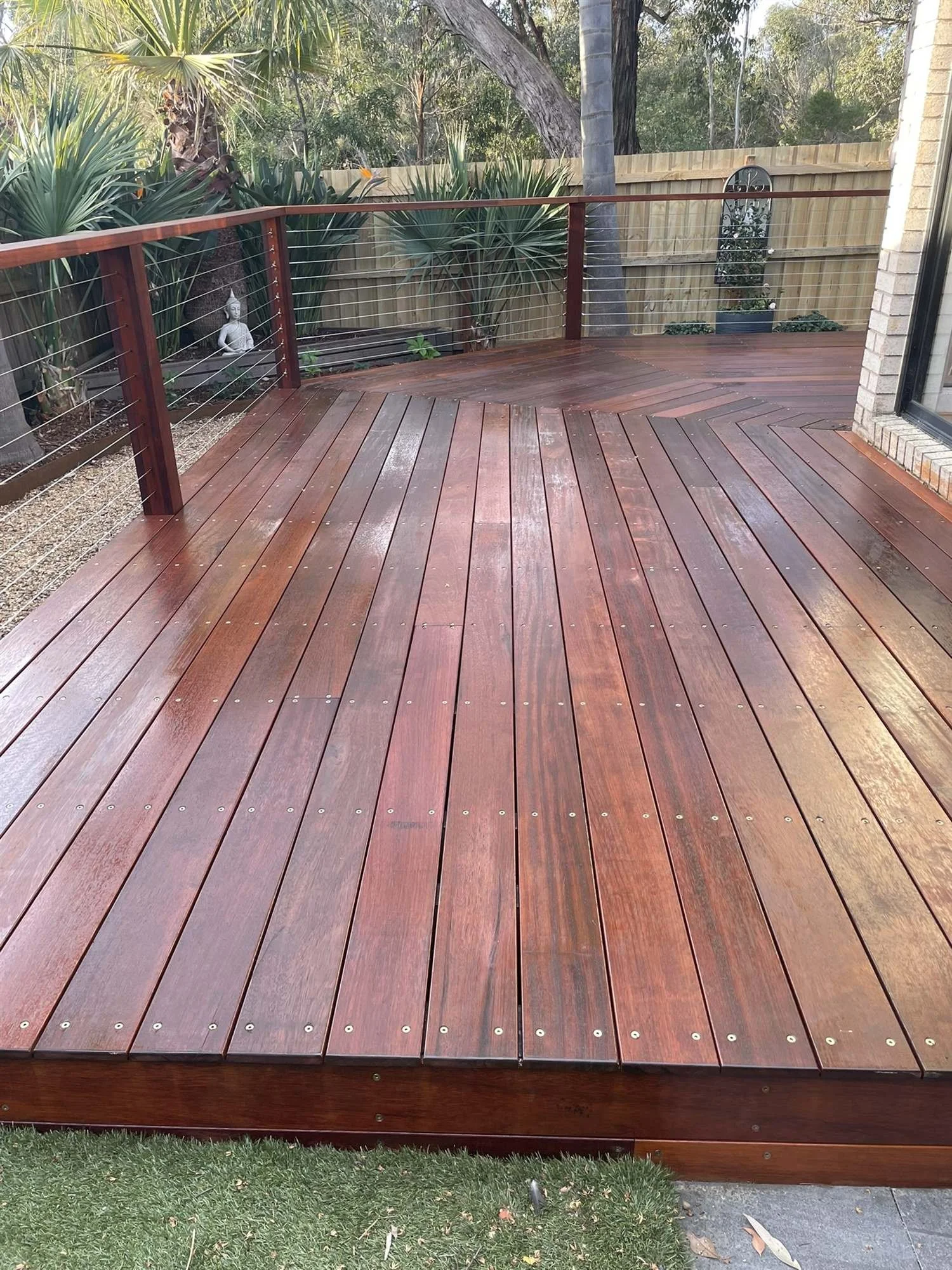 Finished edge of a newly oiled hardwood deck