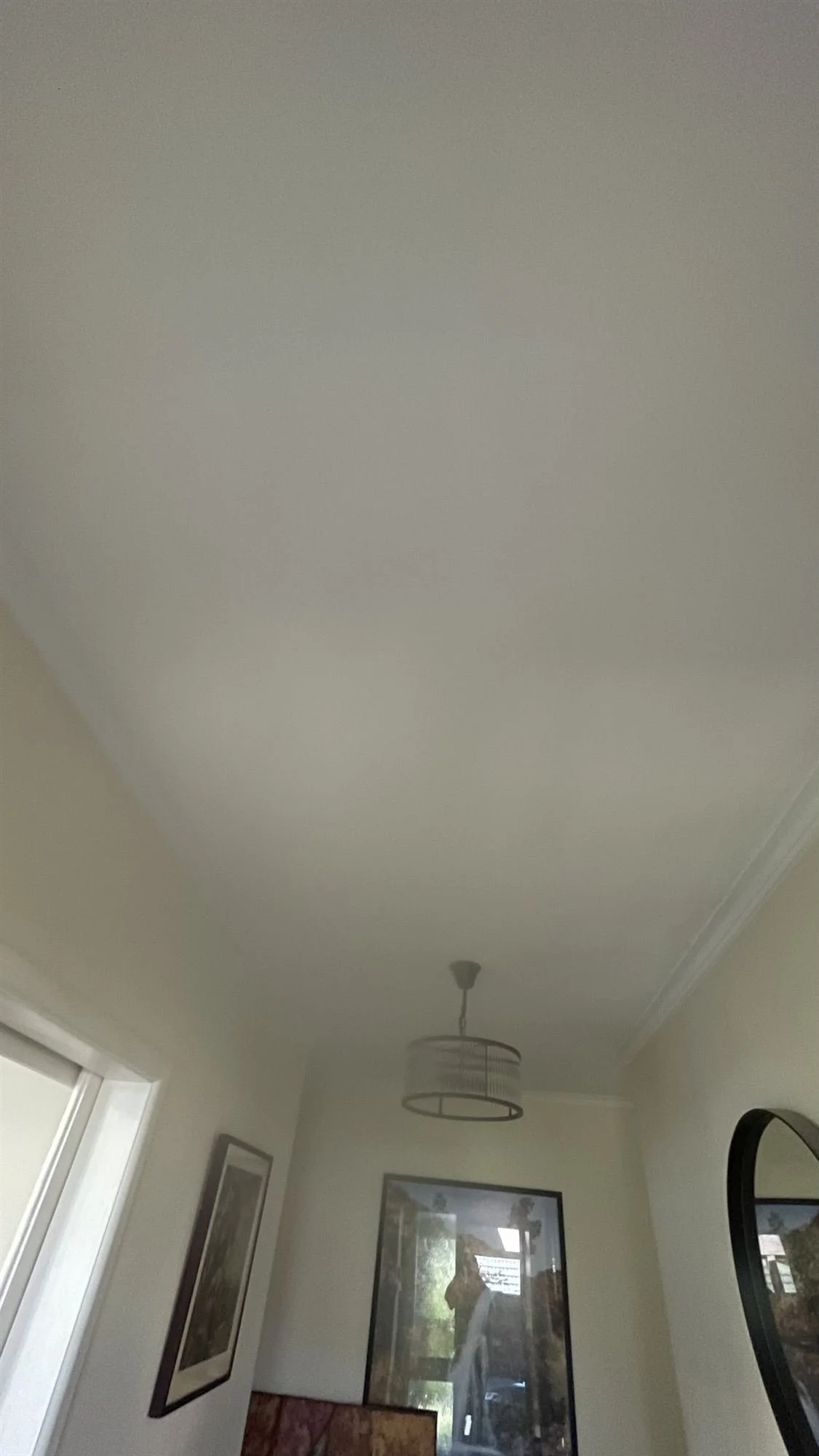 Freshly painted hallway ceiling in flat white