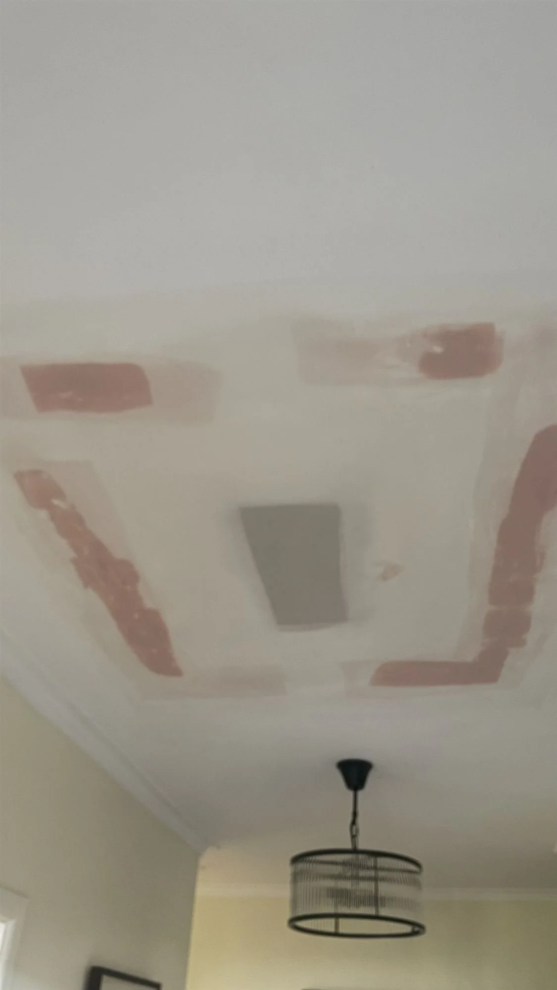Hallway ceiling with plaster patches before painting